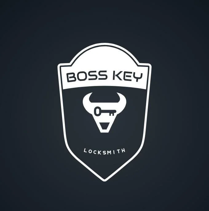 Logo for Boss Key Locksmith featuring a shield with a bull's head and a key as the eyes under the text.