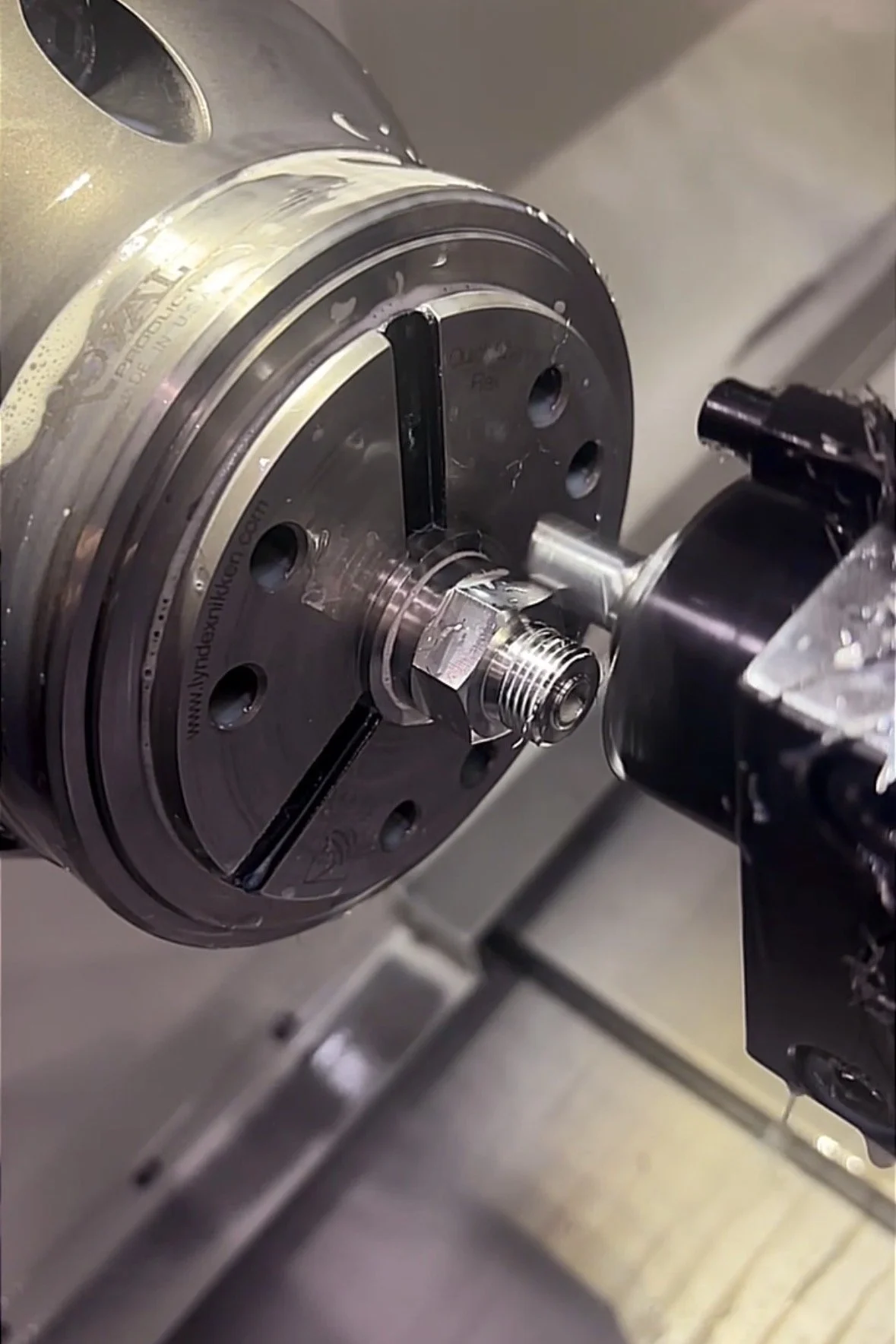 Precision machining process with a lathe machine shaping a metal workpiece.