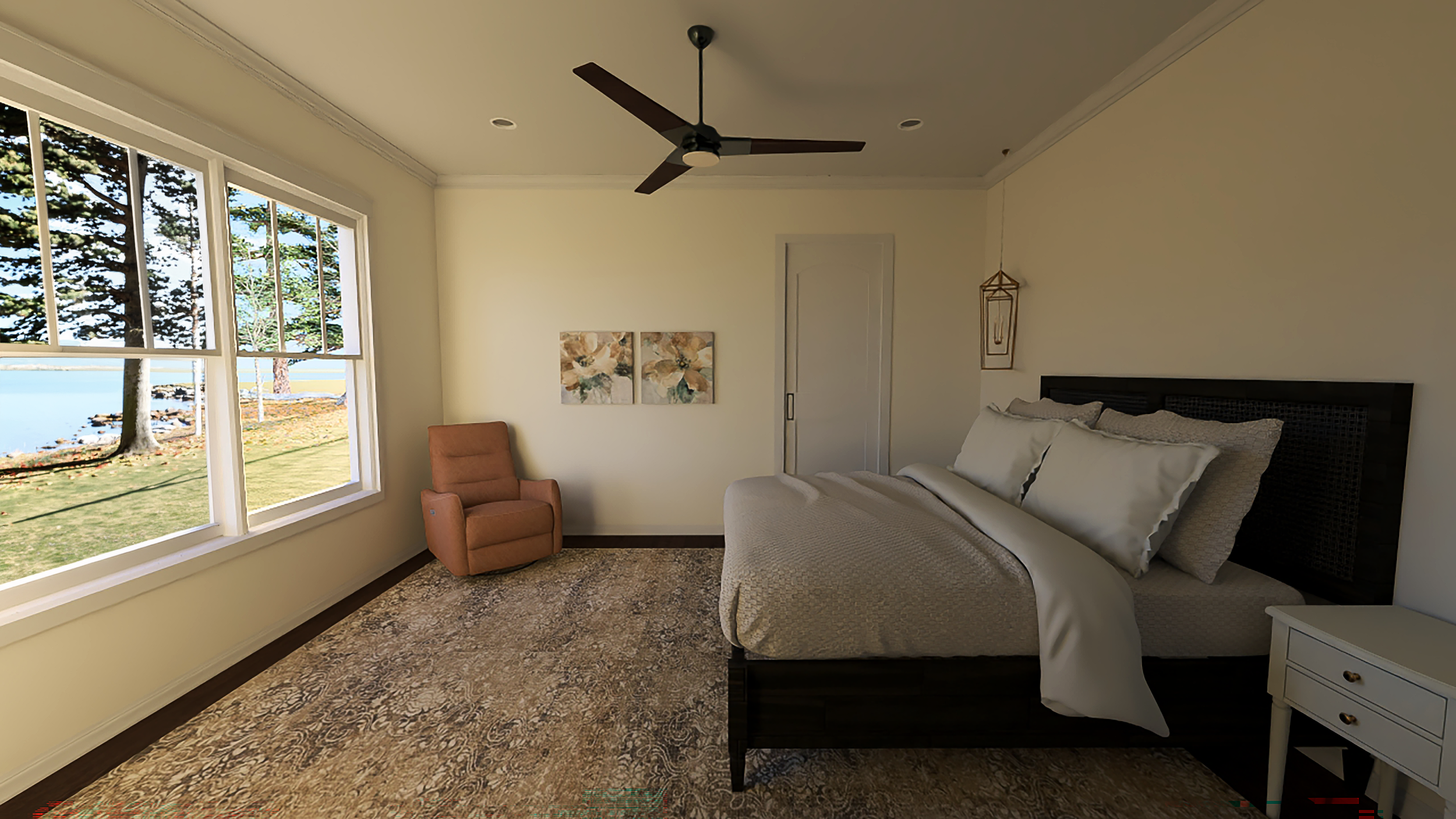 A bedroom with large window showing trees and water outside, beige walls, a brown armchair, a bed with white bedding and pillows, wall art, a ceiling fan, and a hanging light.