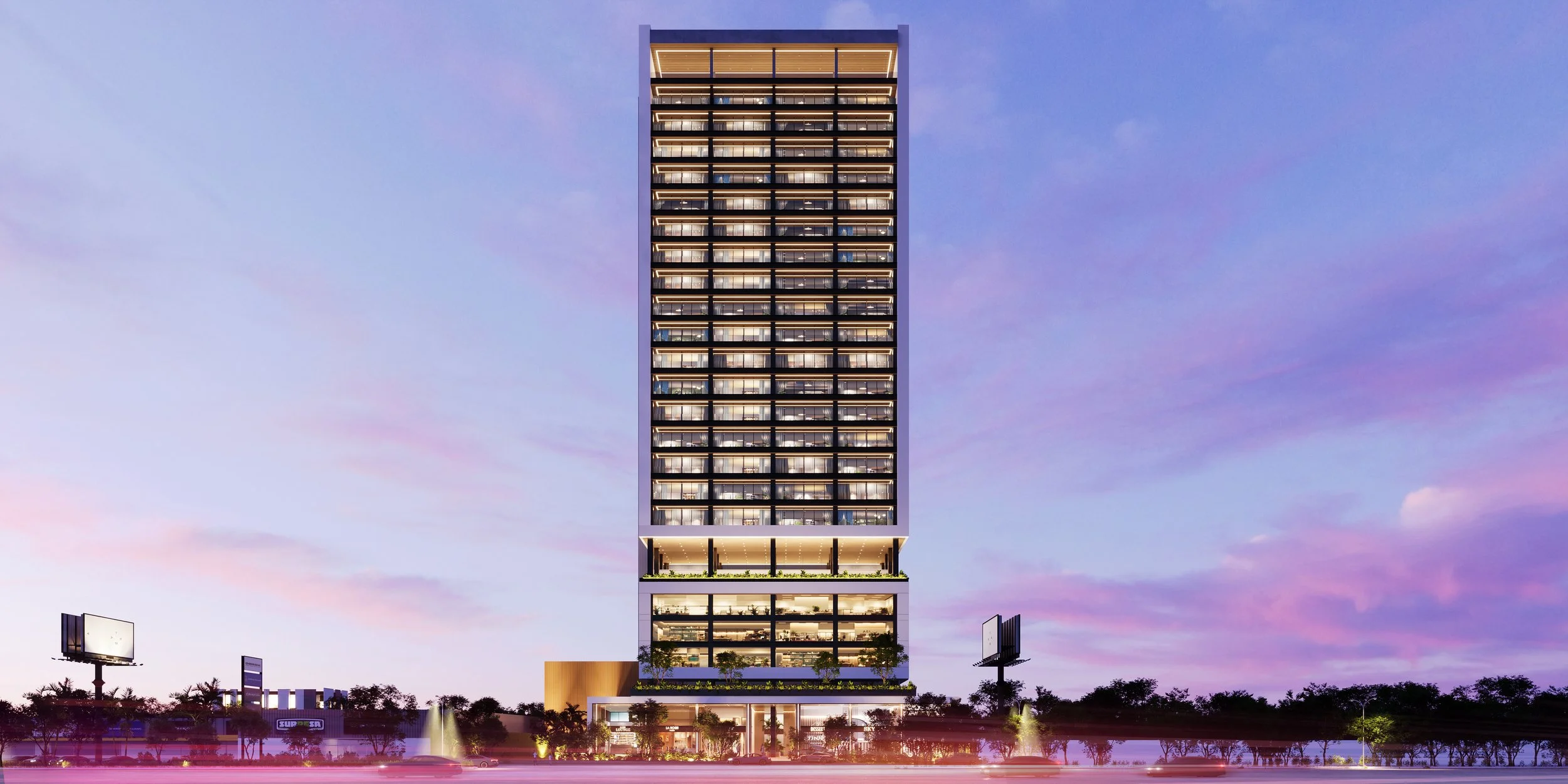 Edificio alto de estructura moderna, con varias plantas de ventanas iluminadas, en el atardecer, con cielo de tonos morados y rosas, y áreas verdes en la base.