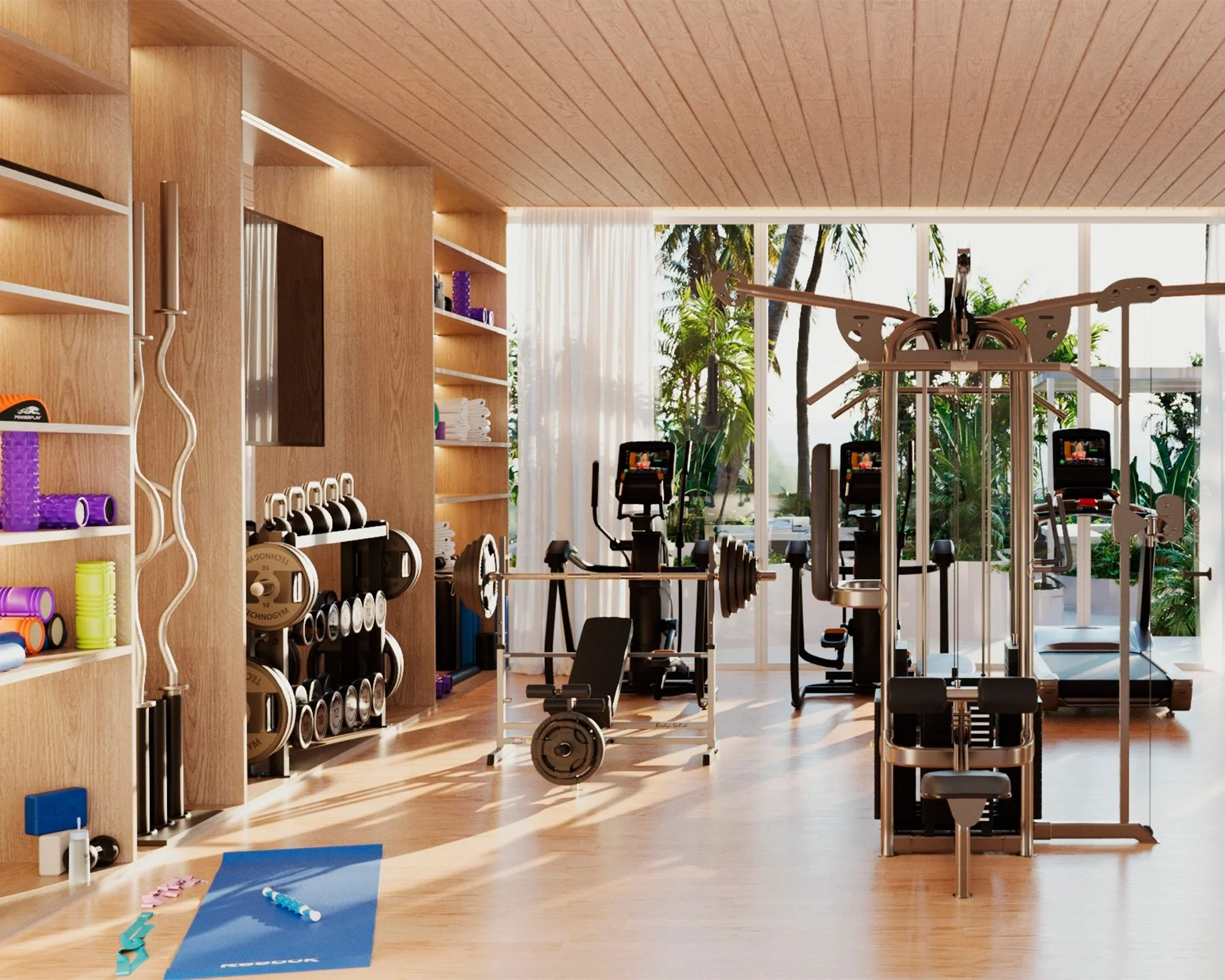 Interior de gimnasio con máquinas de ejercicio, estantes con pesas y accesorios deportivos, grandes ventanas con vista a plantas tropicales, y colchonetas de yoga en el suelo.