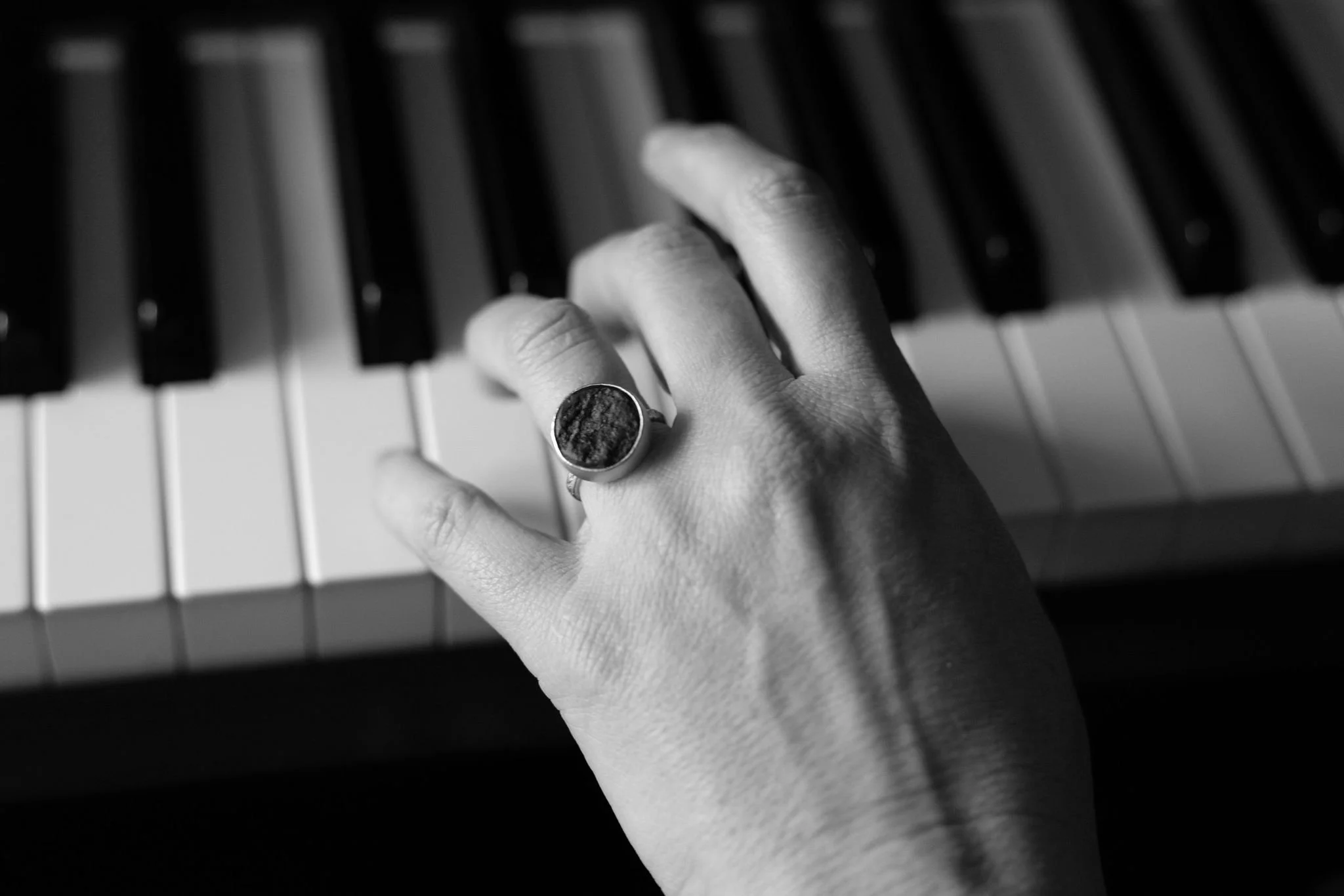 Liz at the piano with ring