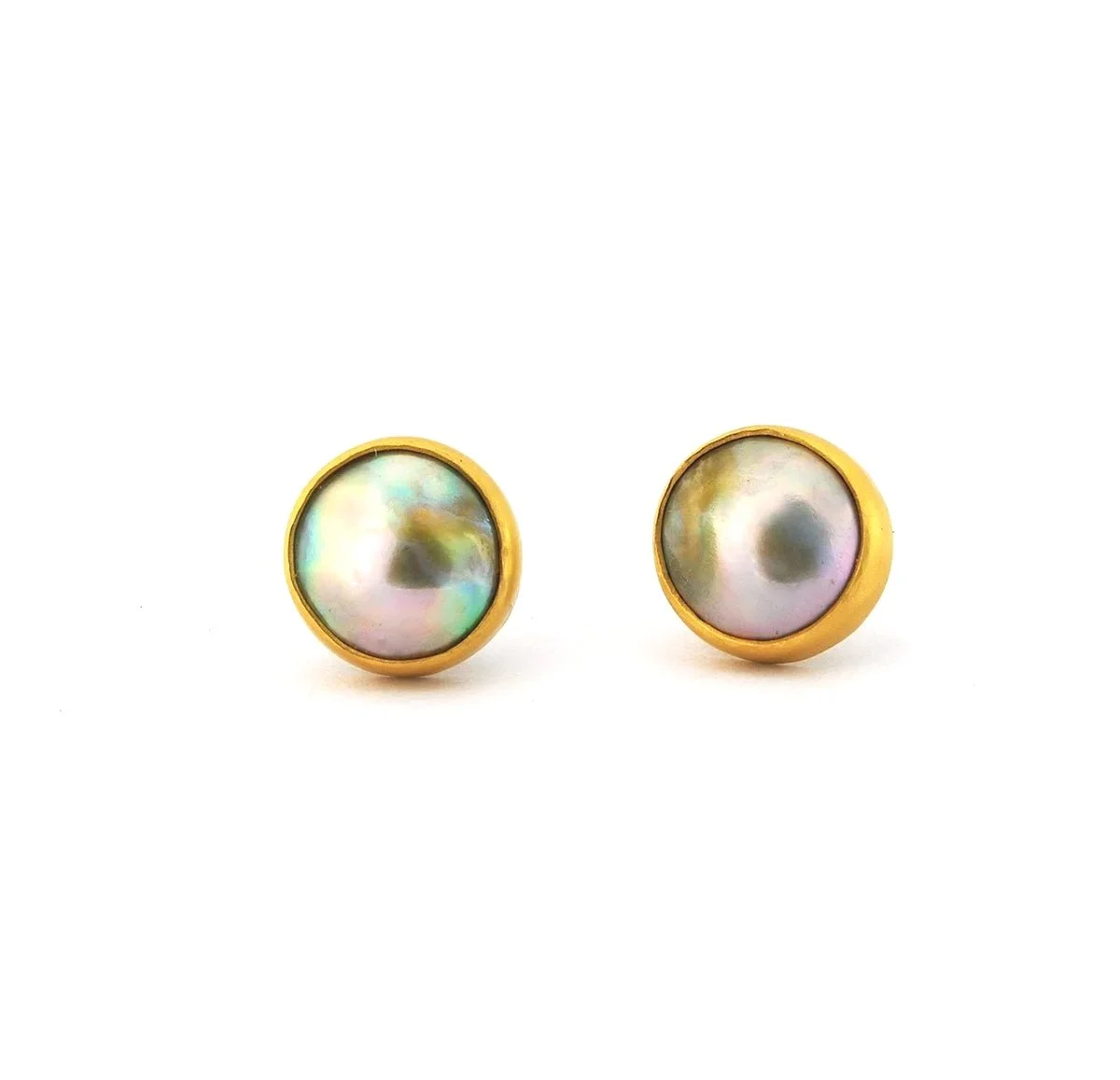 Pair of round pearl earrings with gold backing and iridescent surface.