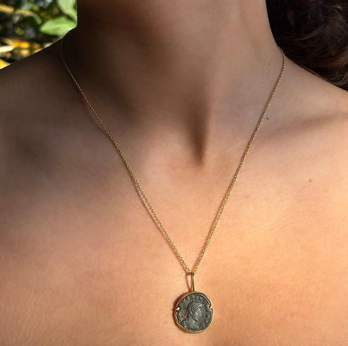 Ancient bronze coin pendant