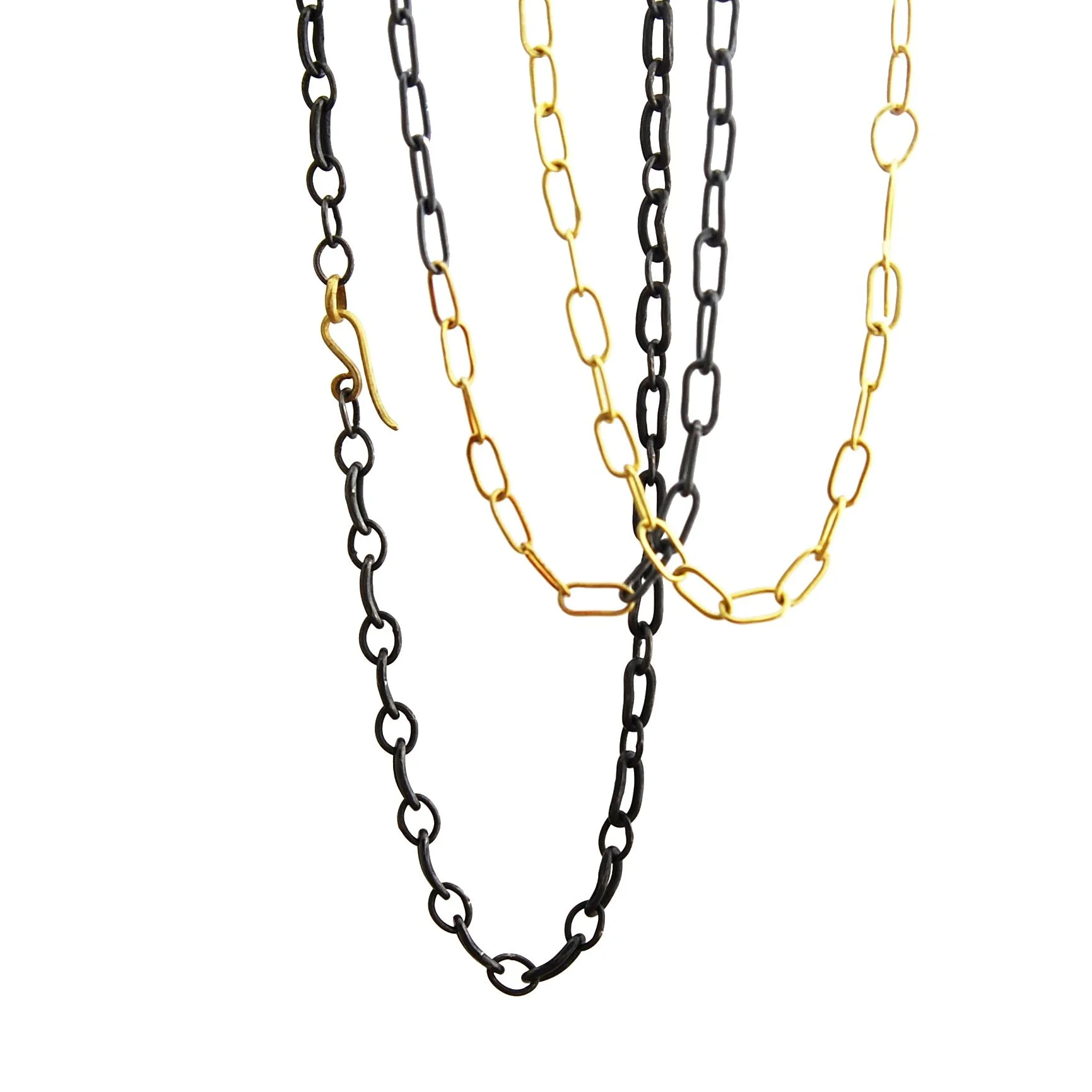 selection of handmade oxidized silver and 18k gold chains