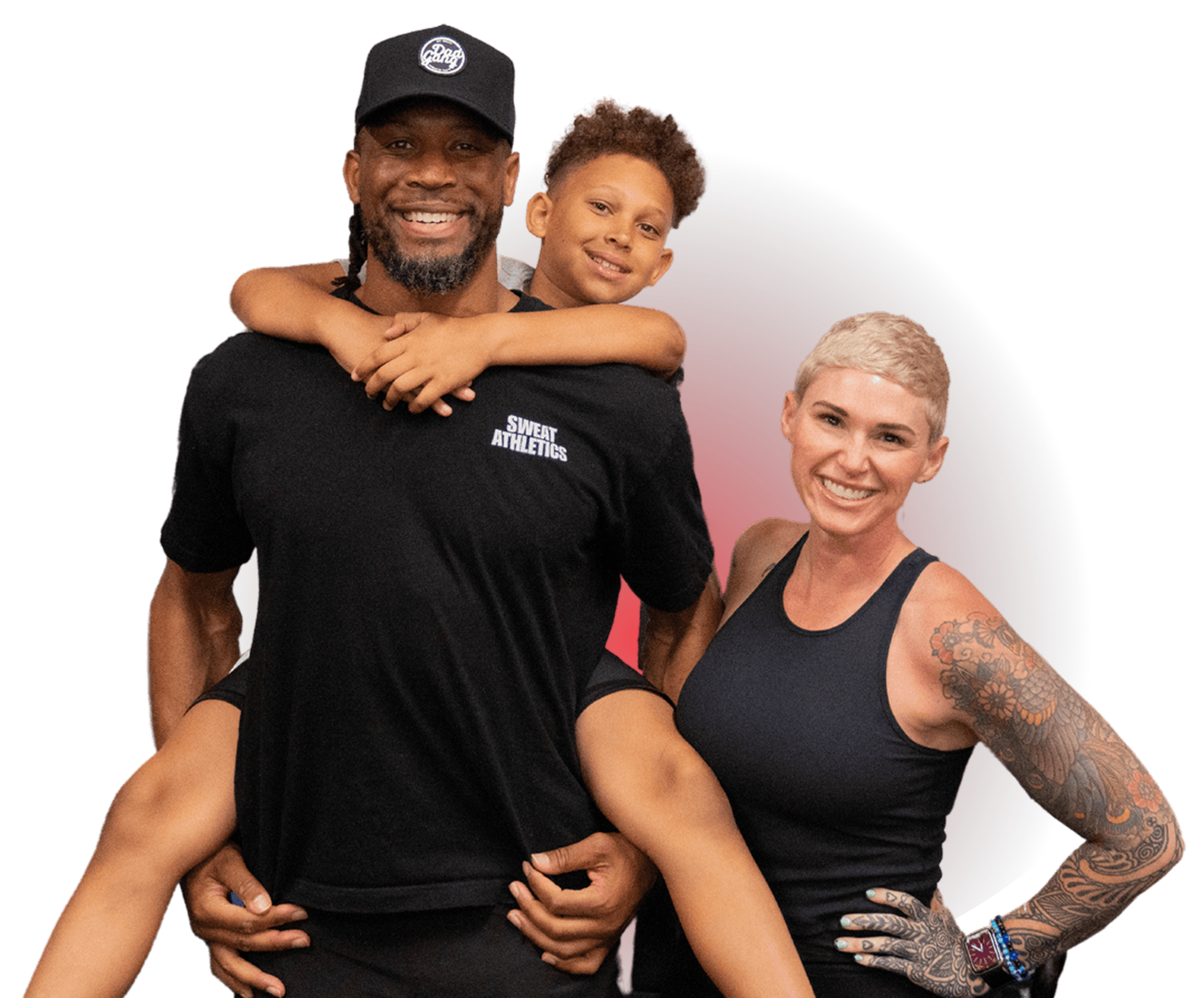 A group of diverse people, including an African American man, a young boy, and a woman with tattoos, all smiling and hugging each other.