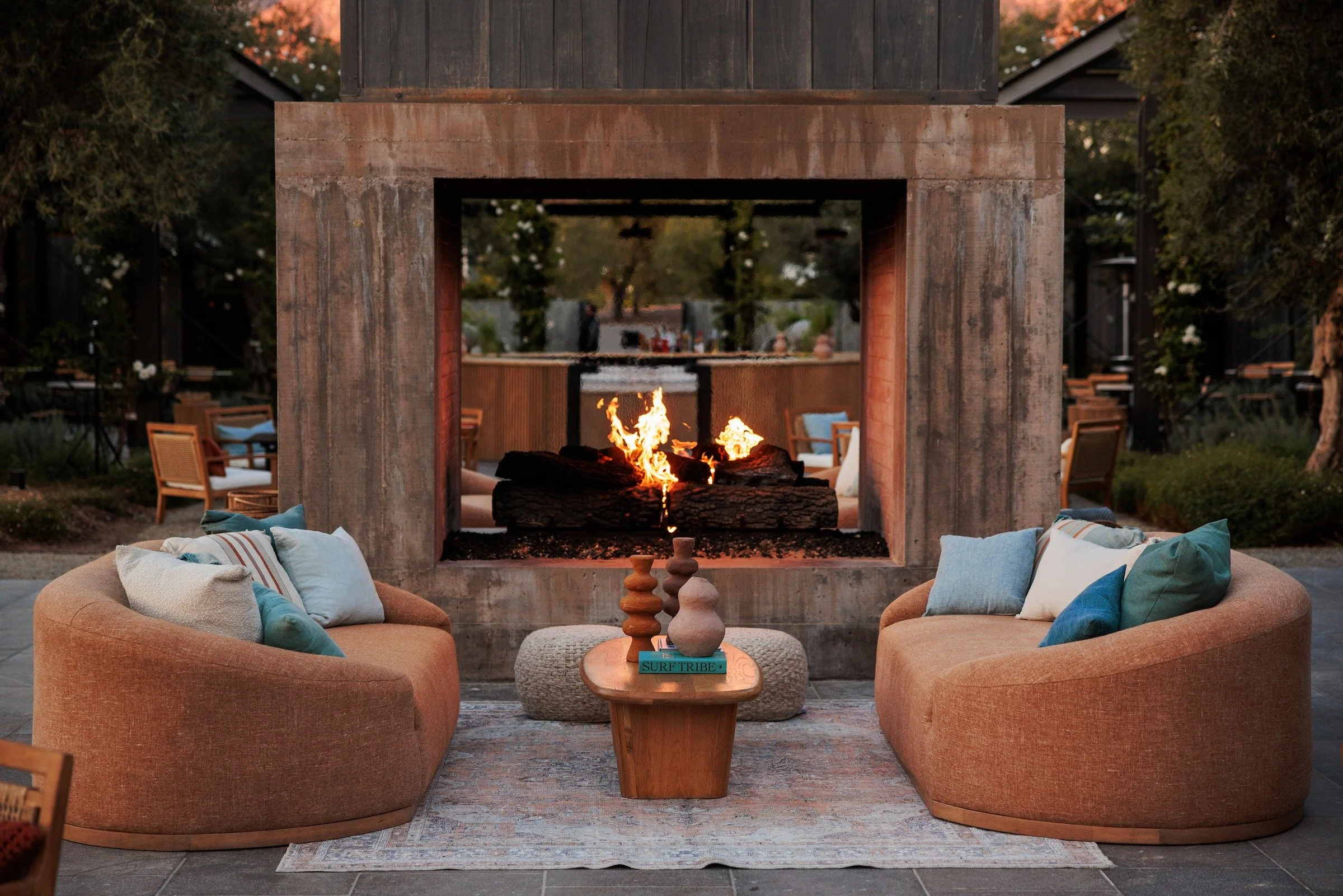 Luxury lounge seating area with fireplace at high-end corporate event — Grove Projects