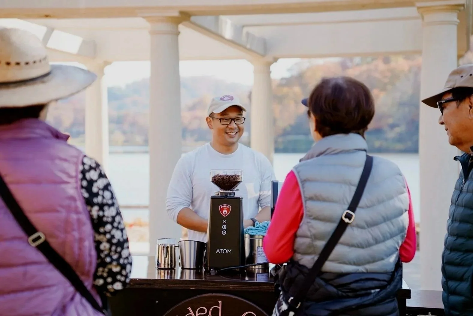 Braided Cord Coffee barista serving espresso at an Asheville NC event