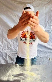 Raffaele throwing flour1.jpg