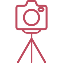 Icon of a vintage-style camera on a tripod
