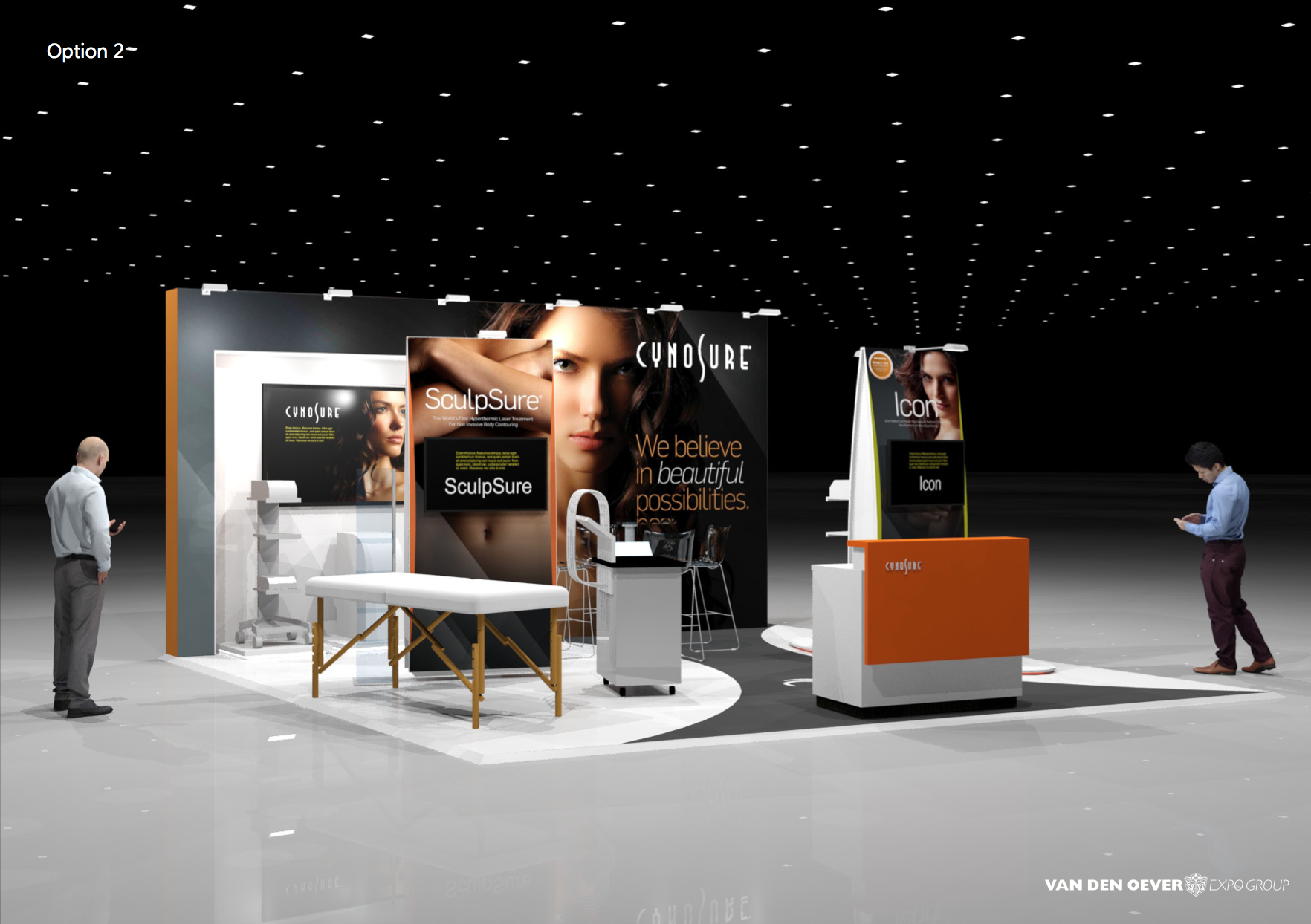 Trade show booth for Cynosure with promotional posters of a woman, a treatment table, and various displays. Two men are looking at their phones nearby. The booth features product branding and an orange counter.