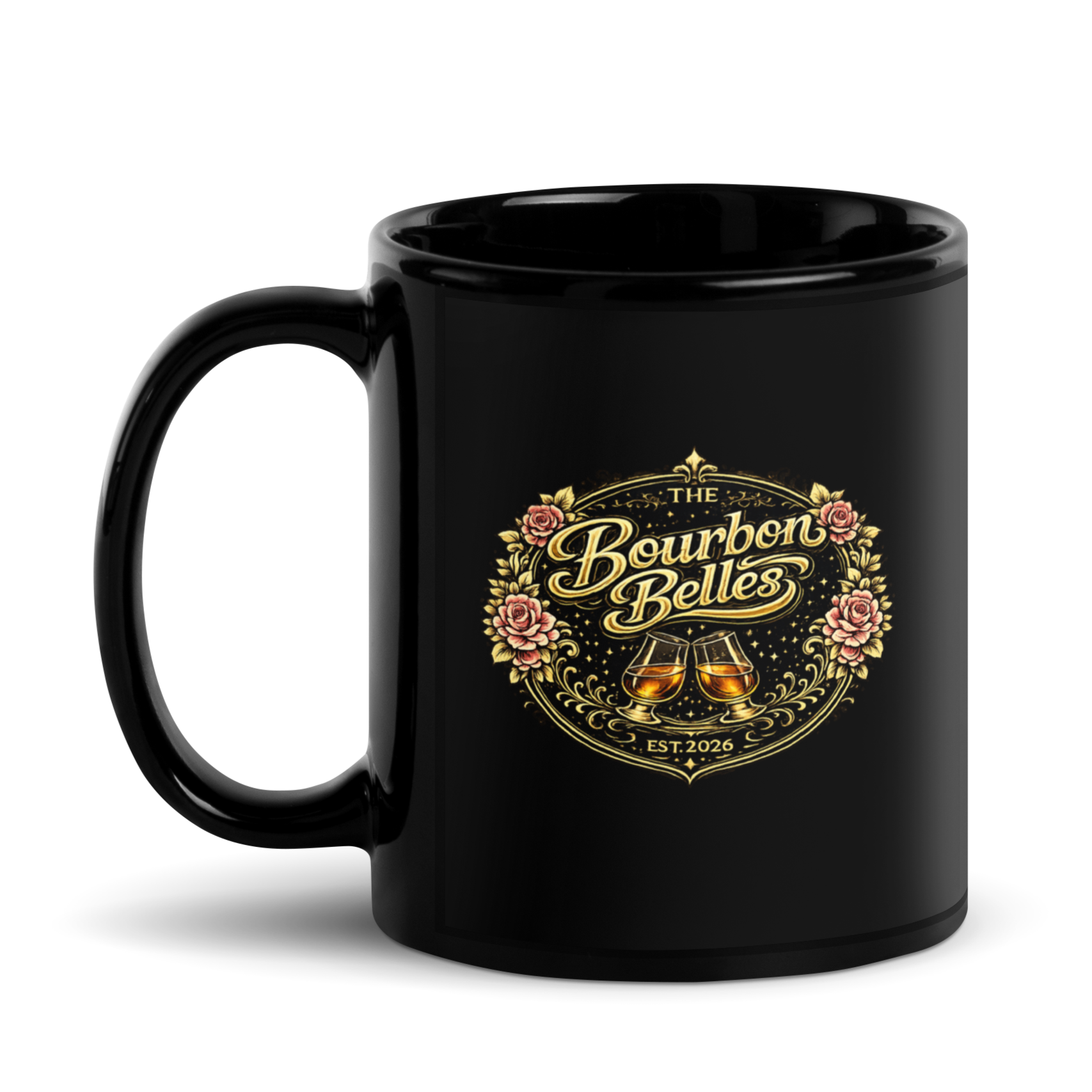 Black mug with gold and pink floral design and the words "The Bourbon Belles," featuring two whiskey glasses.