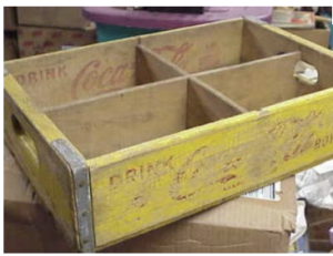 faded-yellow-wooden-coca-cola-crate.webp