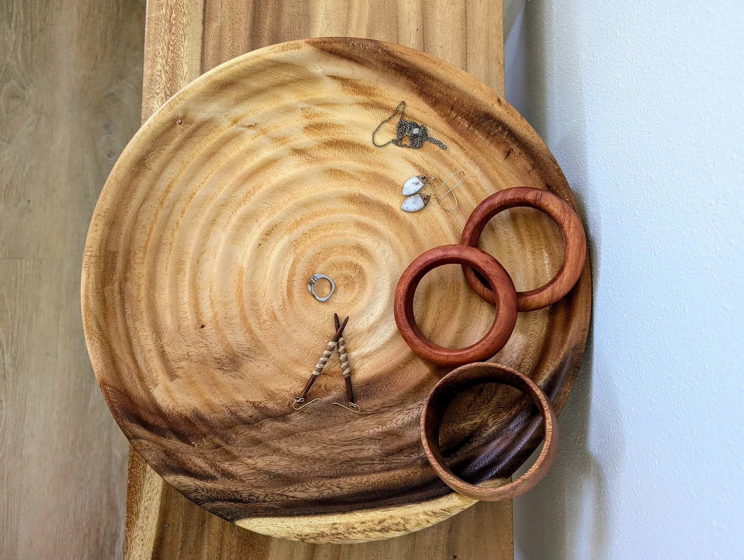 Custom bowls, plates, bangles, earrings, and other jewelry.
