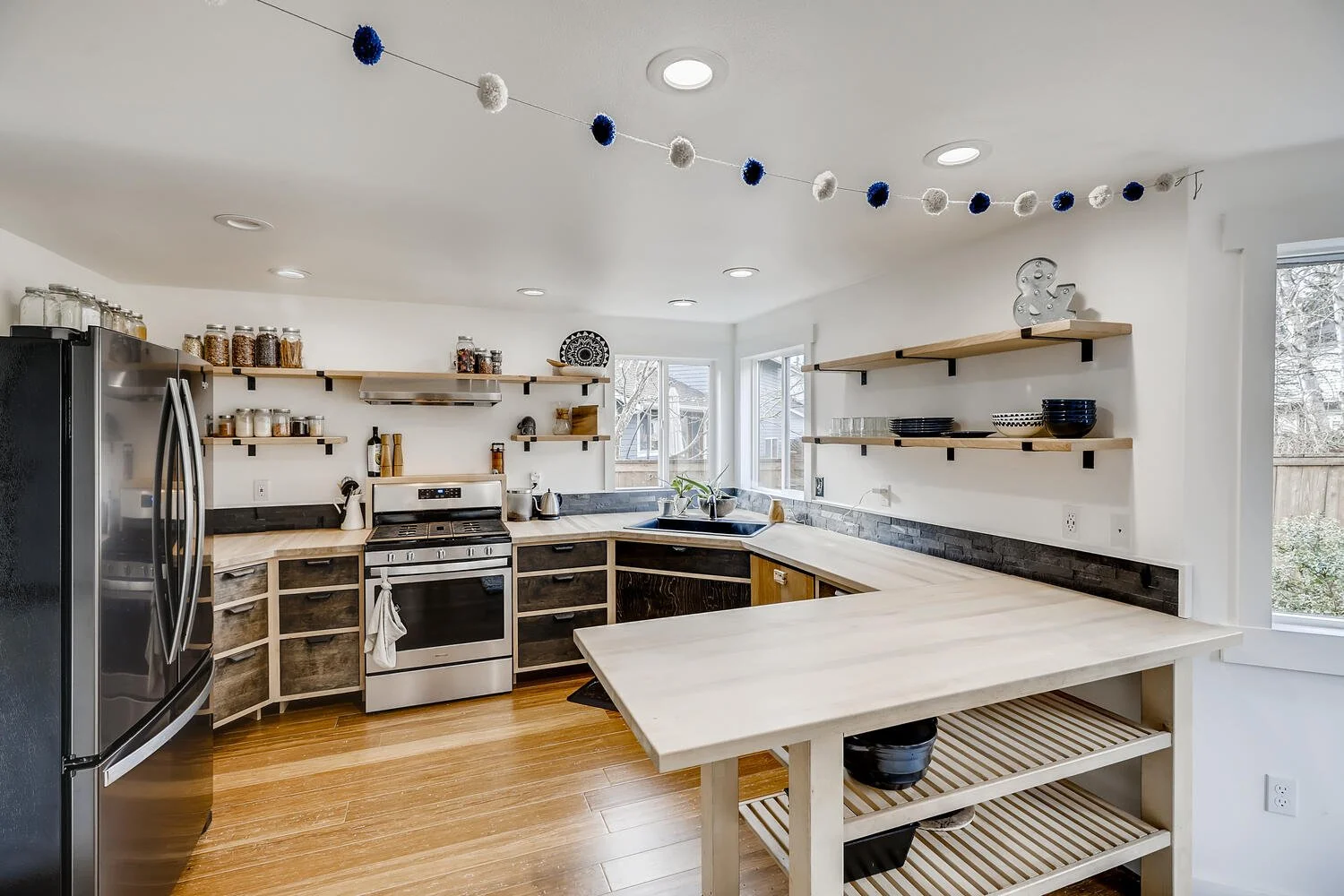 Kitchen remodel with handcrafted cabinetry and shelving.