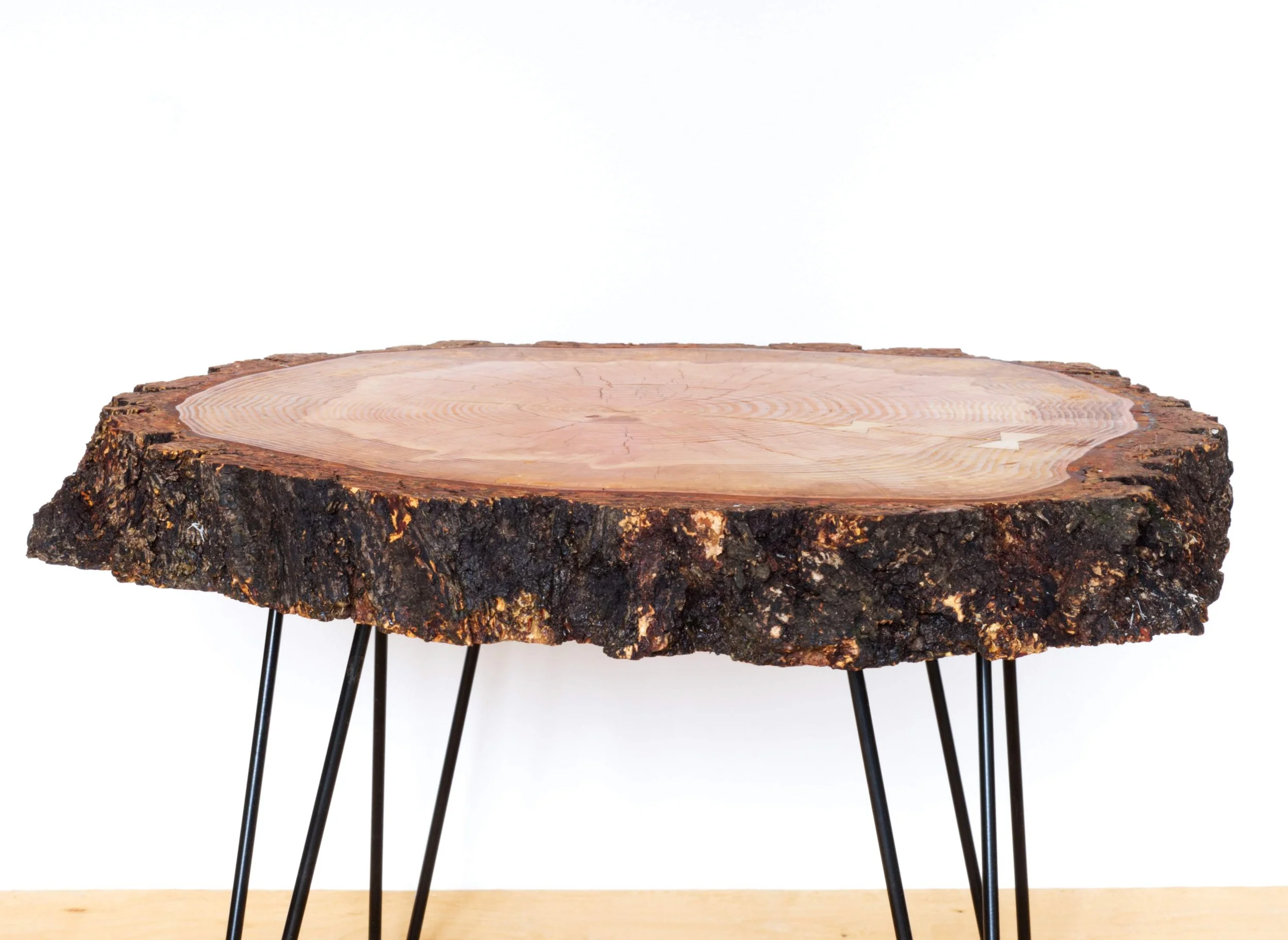Custom wood round table with hairpin legs.