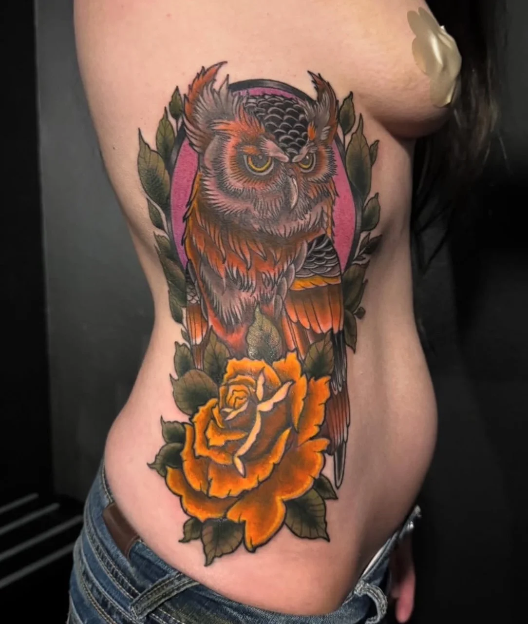 Neo-traditional owl tattoo on a person's rib cage, done by Colton in Jefferson County.