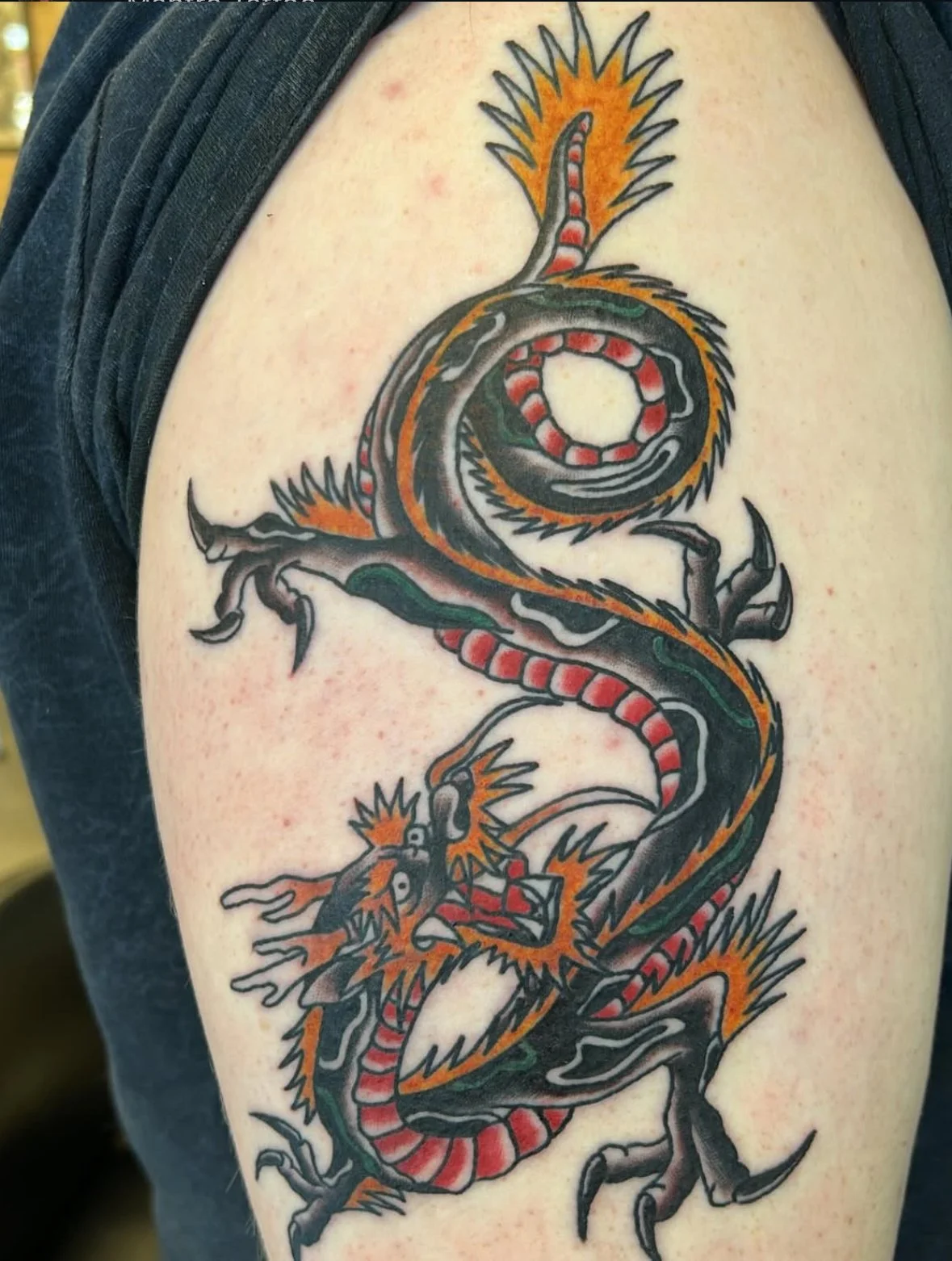 Japanese-style dragon tattoo created by our artist in our studio in Denver West.