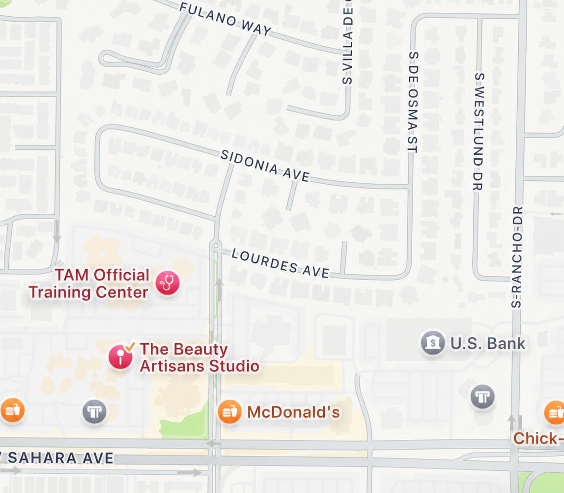 Map showing streets and landmarks, including TAM Official Training Center, The Beauty Artisans Studio, McDonald's, U.S. Bank, and Chick-fil-A, with street names like Sahara Avenue, Lourdes Avenue, Sidonia Avenue, and Fulano Way.