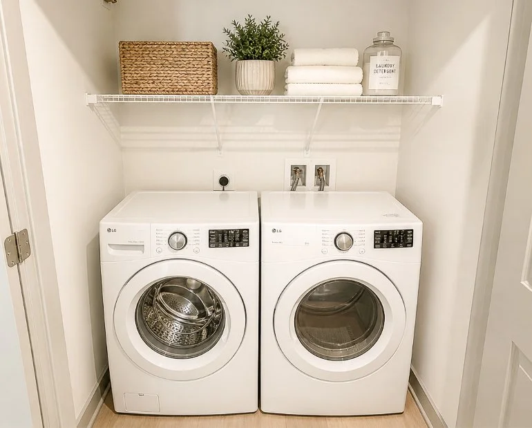 laundry in a closet with a washer and dryer
