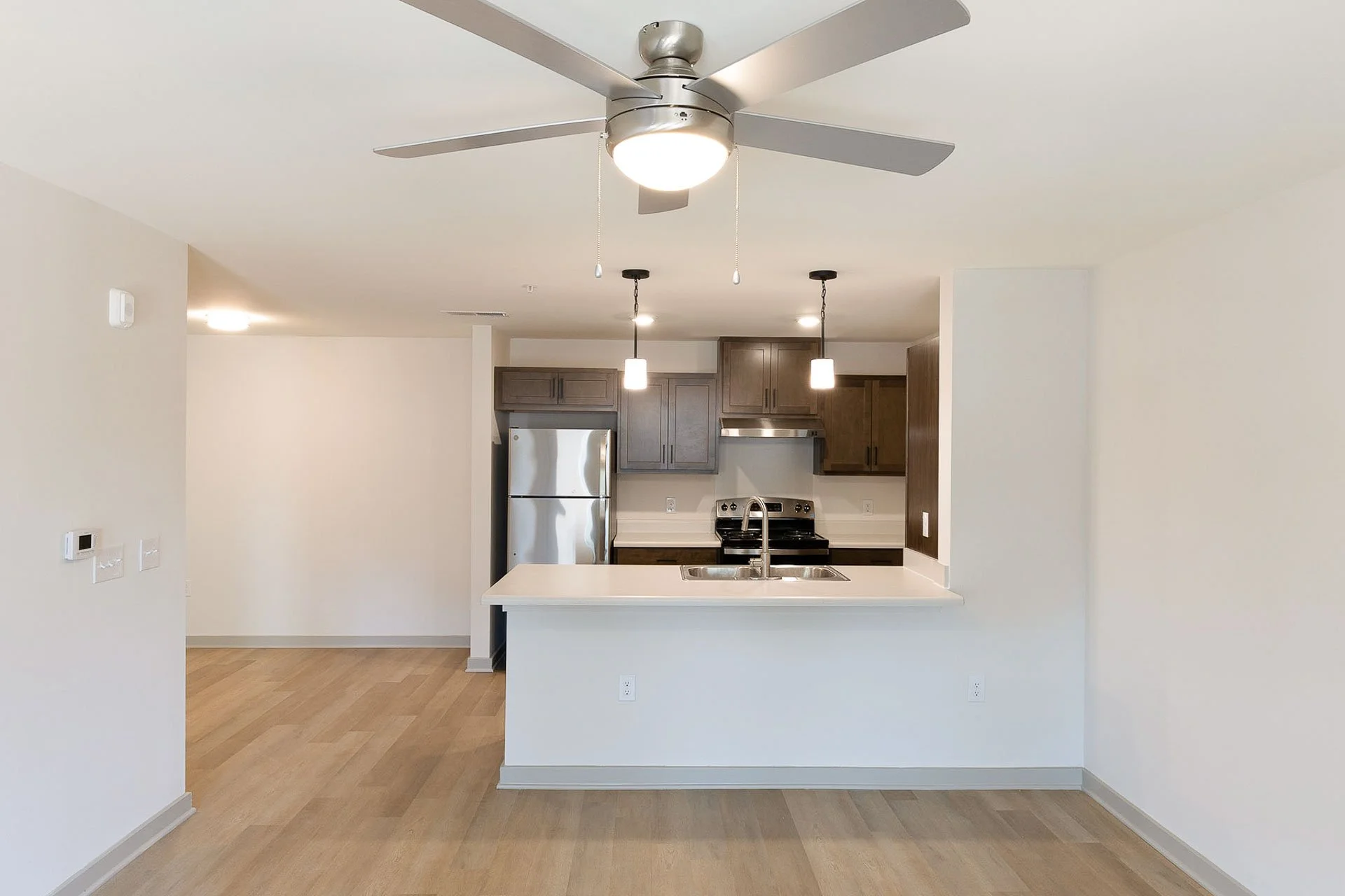 Kitchen with countertop seating option at The Pines at Peach Road