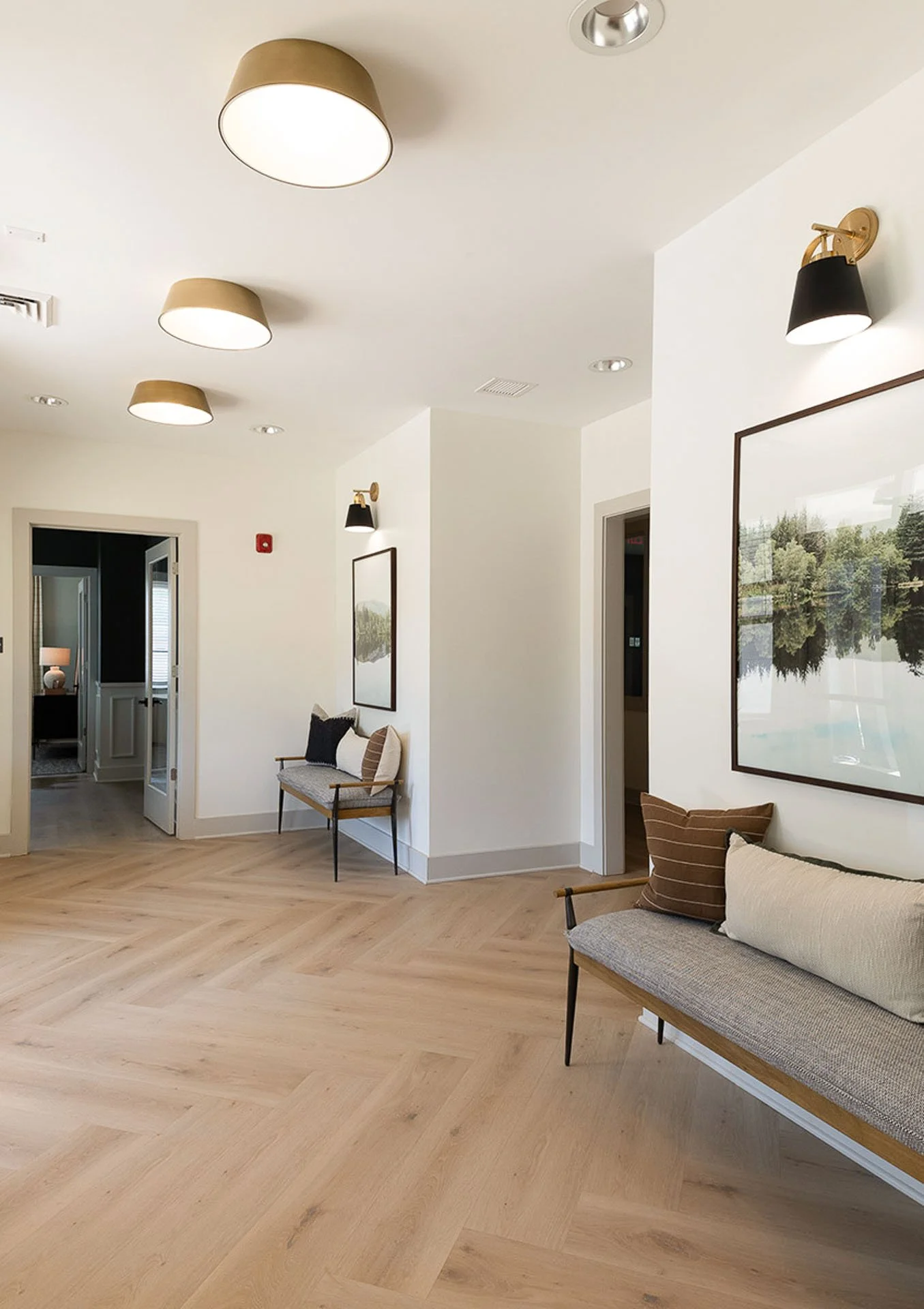 Entry way with light wood flooring at The Pines at Peach Road