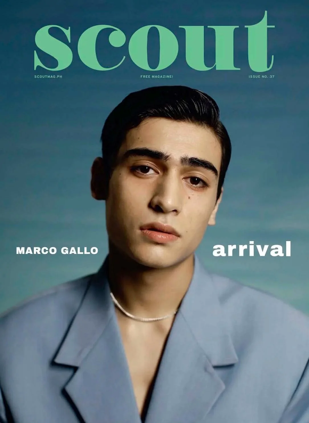Cover of Scout magazine featuring a portrait of a young man with dark hair, wearing a light blue jacket and a pearl necklace, with the title "Scout" in large green letters and the text "Marco Gallo arrival" in white.
