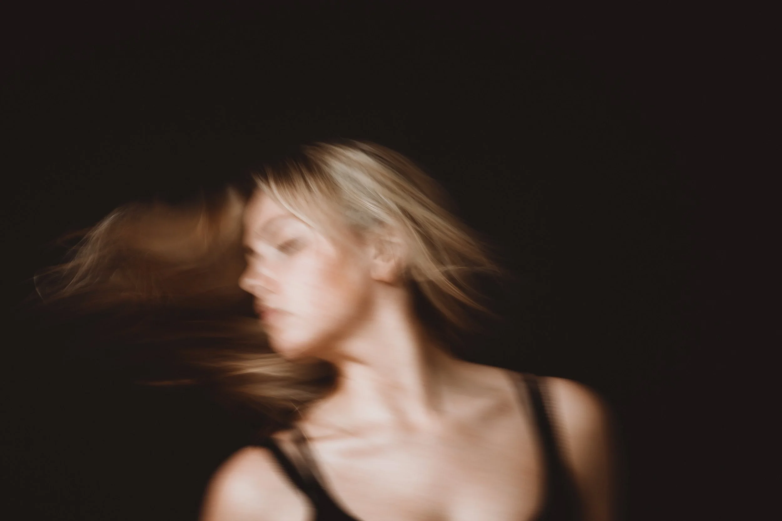woman-with-long-blond-hair-in-motion-blur.jpg