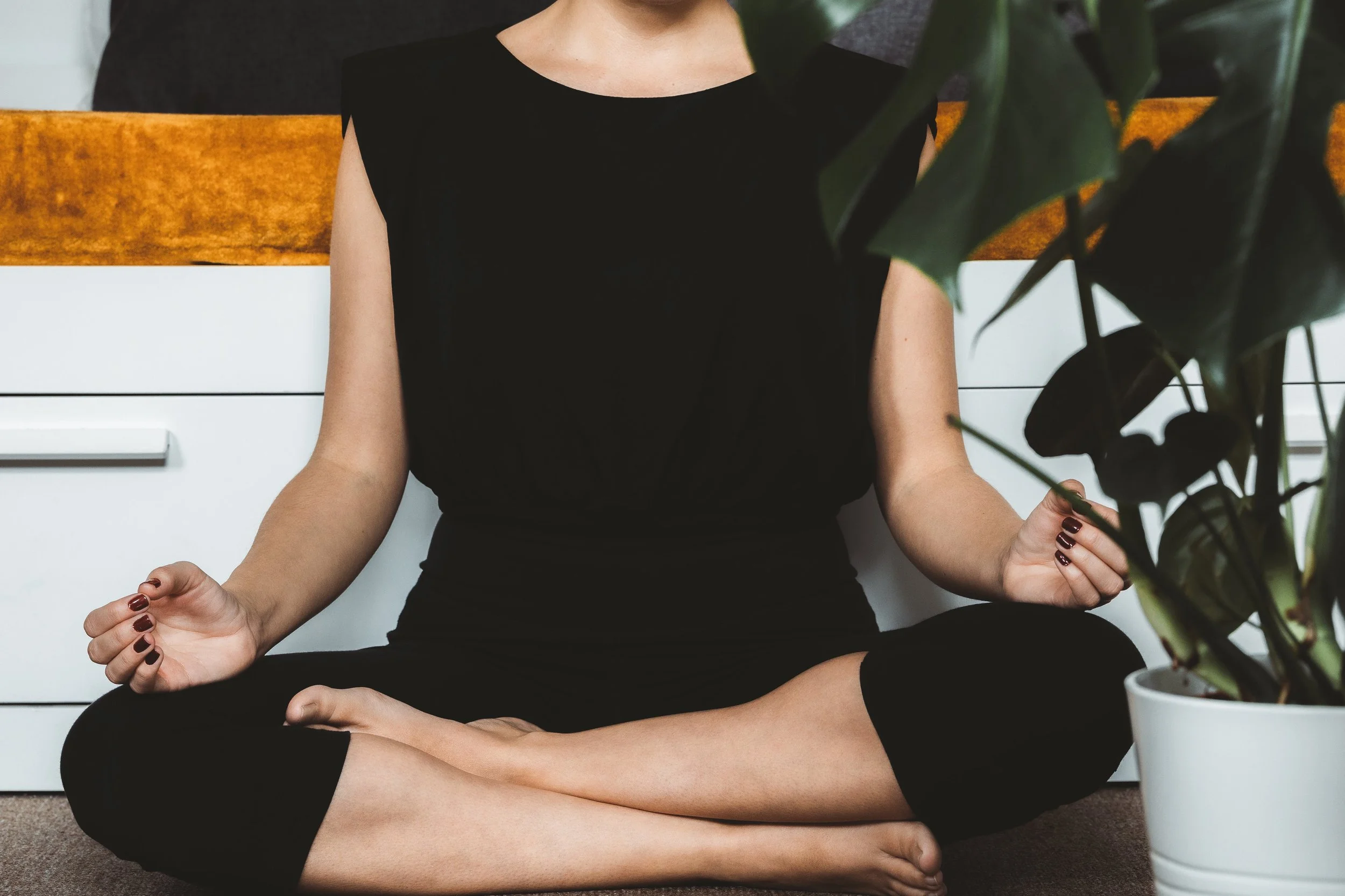 person-sits-in-a-calm-meditation-pose.jpg