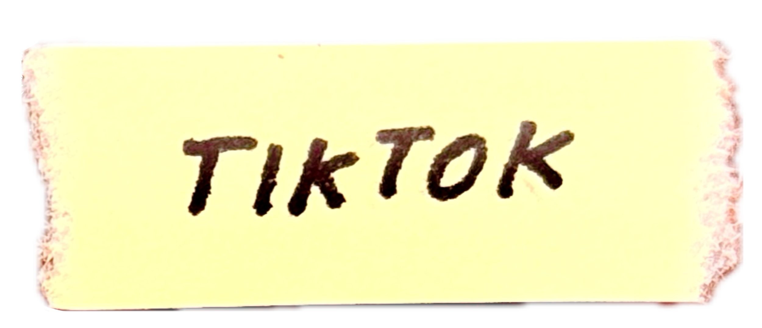 A torn piece of paper with the word 'TIKTOK' written in black ink.