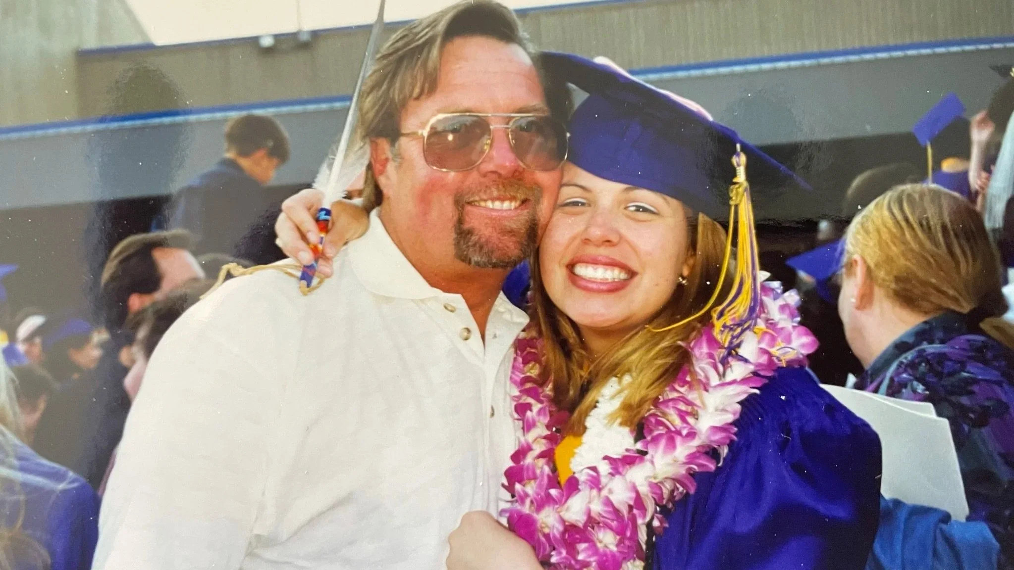 Bettina Smiling at graduation with Father