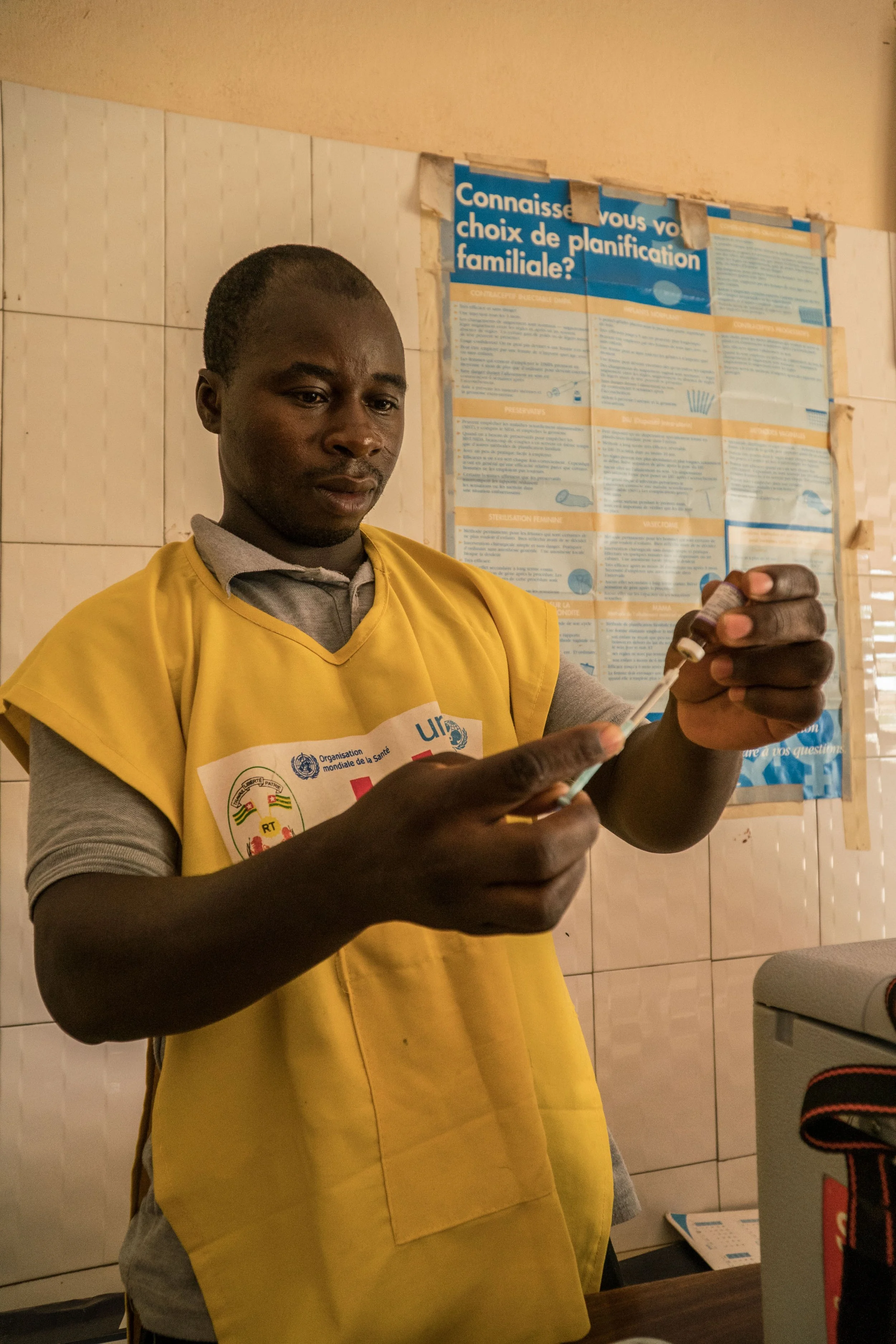 in-a-rural-health-centre-in-nadoba-a-health-worker-is-preparing-a-vaccine---reinier-van-oorsouw--unicef-togo----2019_49078201532_o.jpg