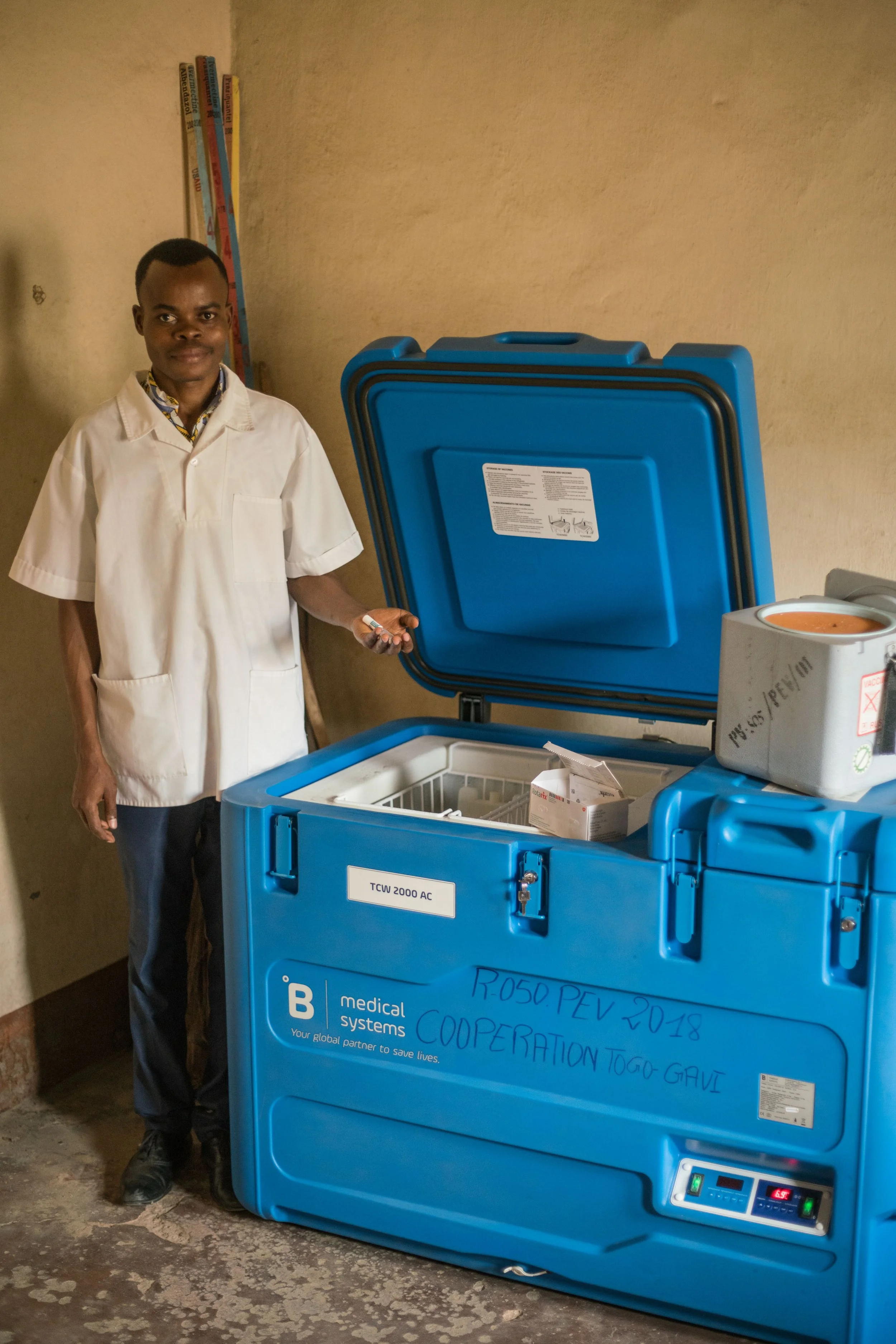 a-health-worker-showing-the-recently-acquired-fridge-for-vaccines---reinier-van-oorsouw--unicef-togo----2019_49248857461_o.jpg