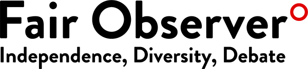 Close-up of a black ink stamp with red ink correction mark.