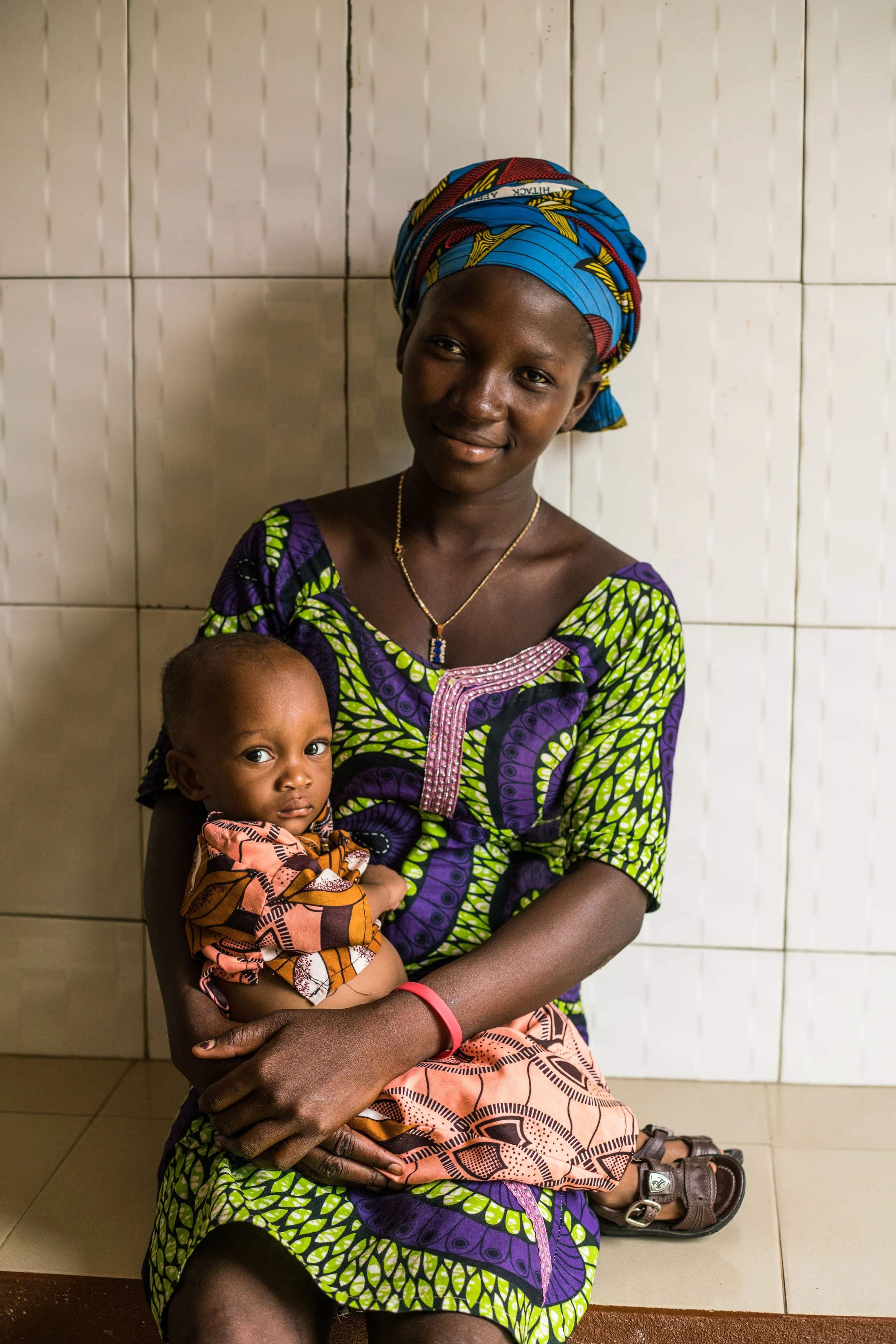 a-mother-and-her-son-portrayed-at-the-nadoba-health-center-after-receiving-vaccinations---reinier-van-oorsouw--unicef-togo----2019_49078006306_o.jpg