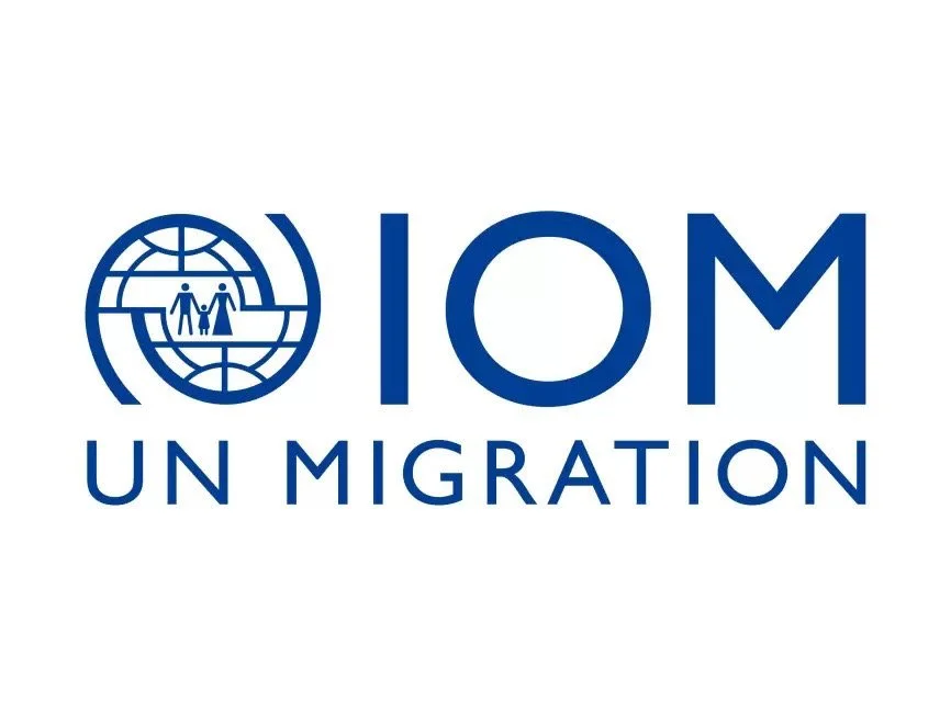 Logo of IOM UN Migration with a globe symbol and human figures inside.