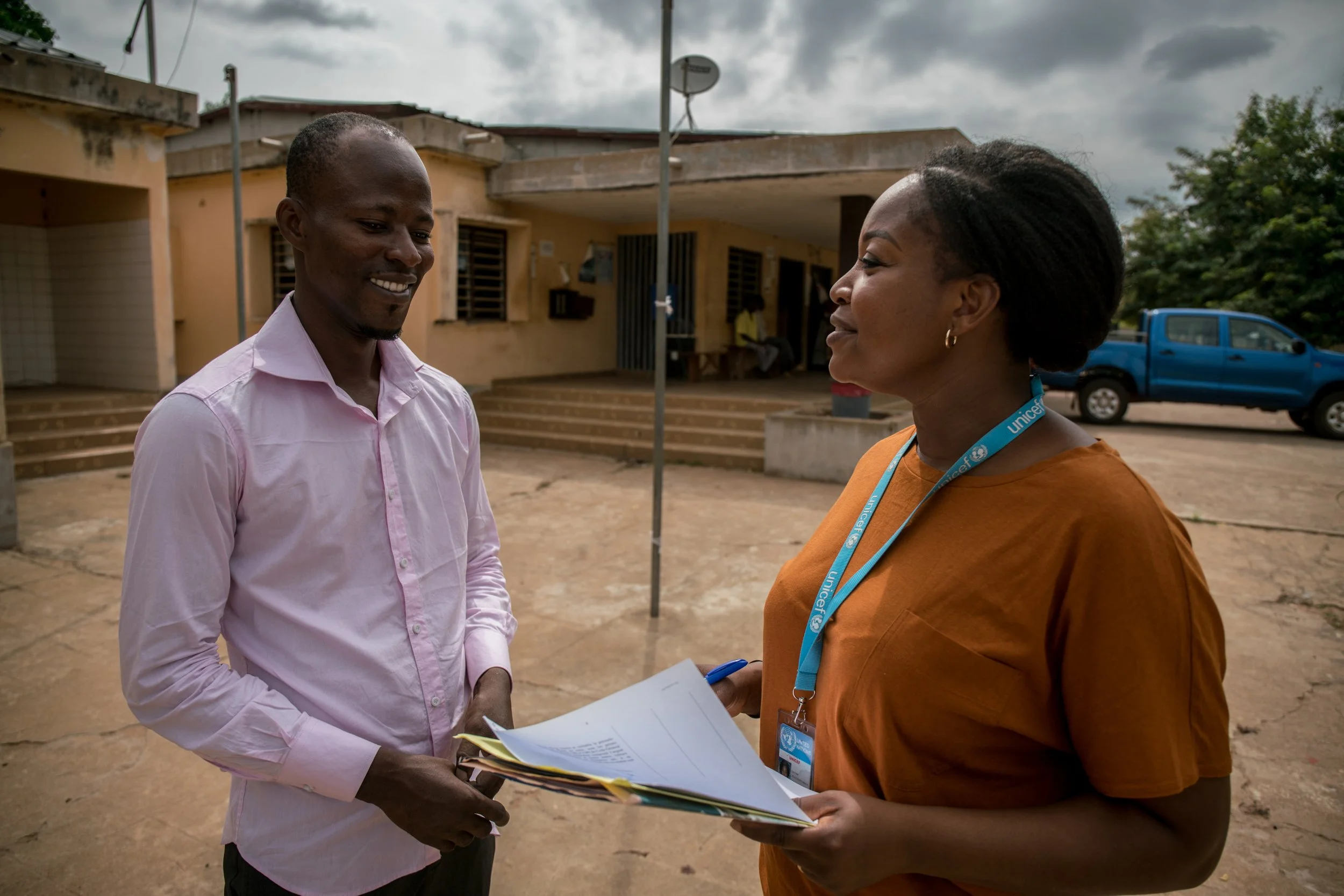 edem-afavi-kwami-is-talking-to-essi-fafa-soule-unicef-in-front-of-the-community-health-center-in-kpendjal-district---reinier-van-oorsouw--unicef-togo----2019_49332796696_o.jpg