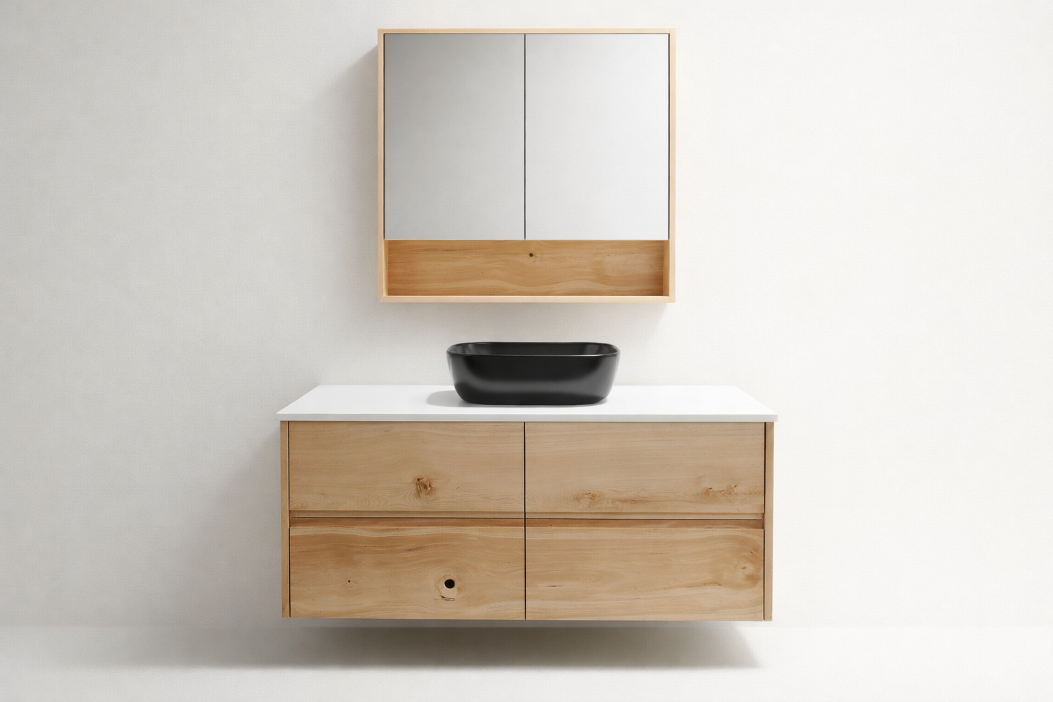 Minimalist bathroom vanity created with Huon Pine timber cabinet, white countertop and matching wall cabinet with mirrored doors and open shelf.