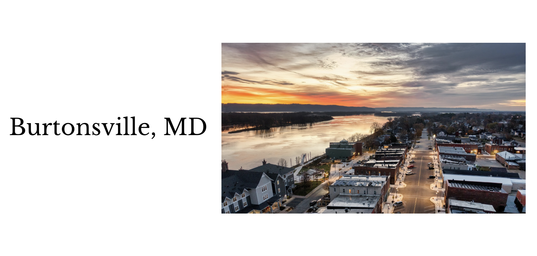 Aerial view of Burtonsville, MD at sunset with river and town buildings.