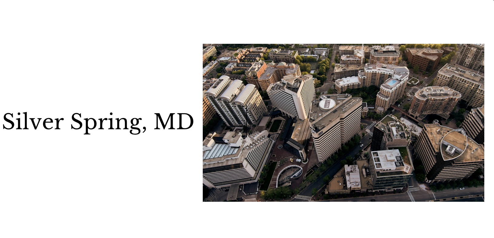 Aerial view of downtown Silver Spring, Maryland showing tall office buildings and city streets.