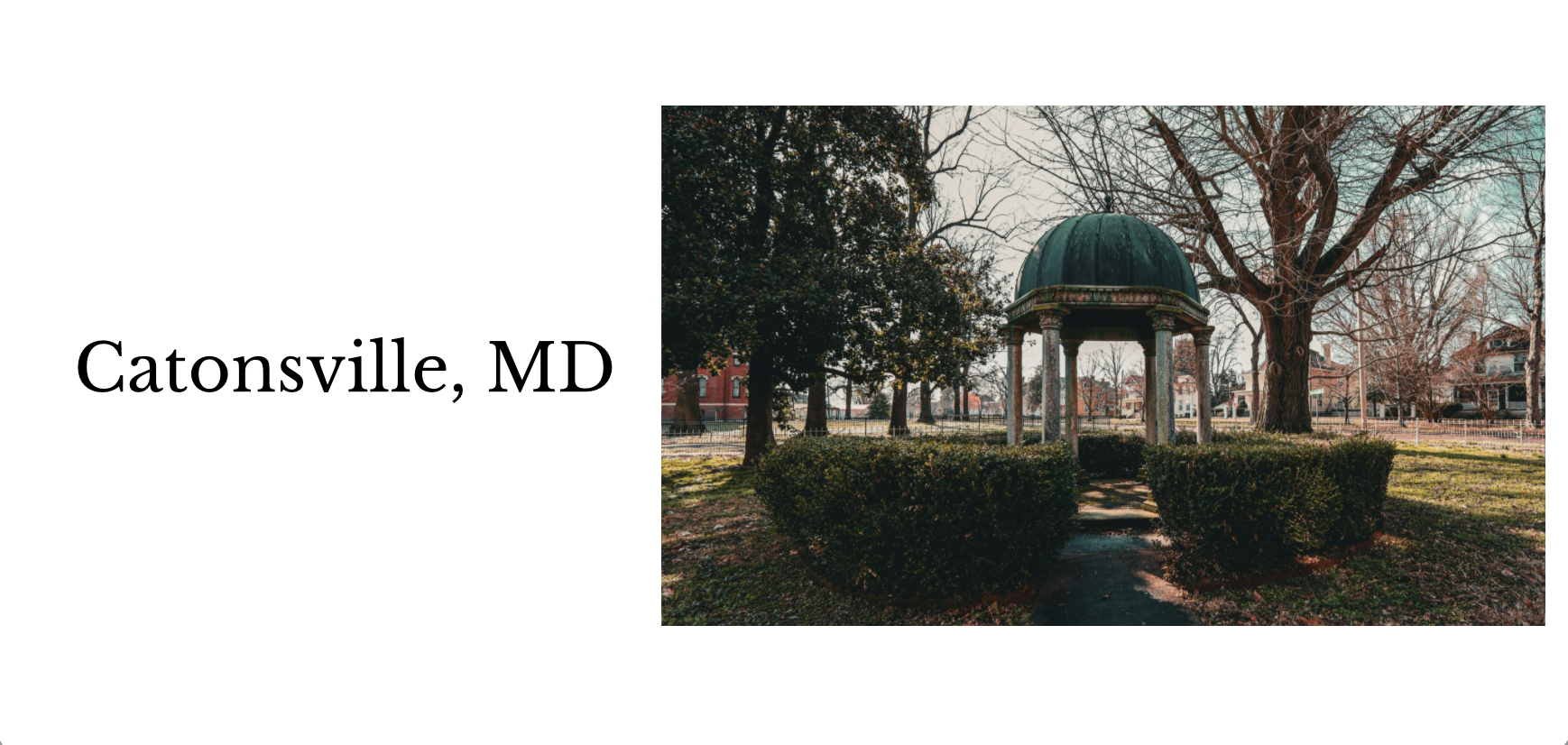 A park with leafless trees, a small pavilion with a domed roof, surrounded by bushes, in Catonsville, Maryland.