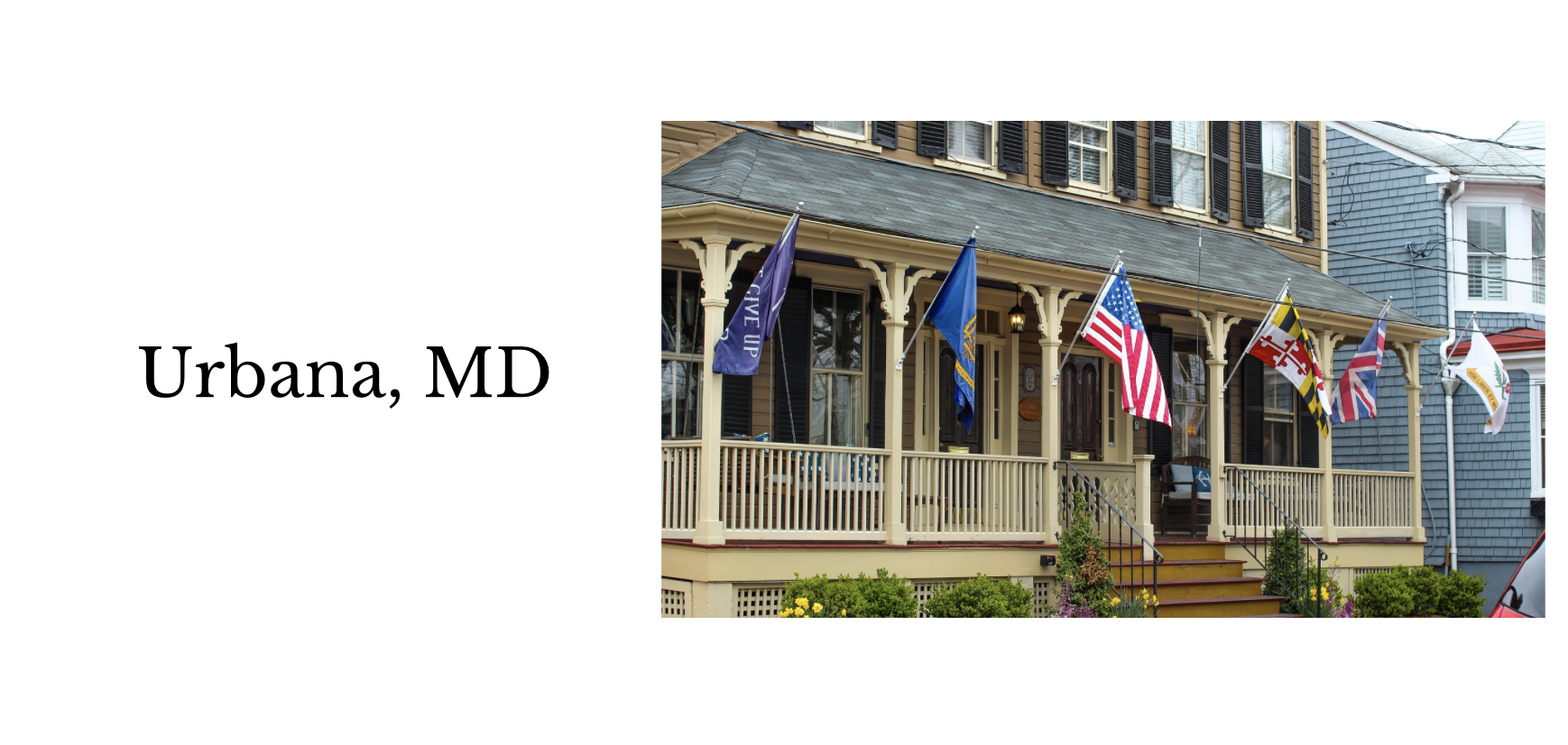 A porch with beige railings and stairs, adorned with multiple flags including American, Maryland, and others, in Urbana, Maryland.