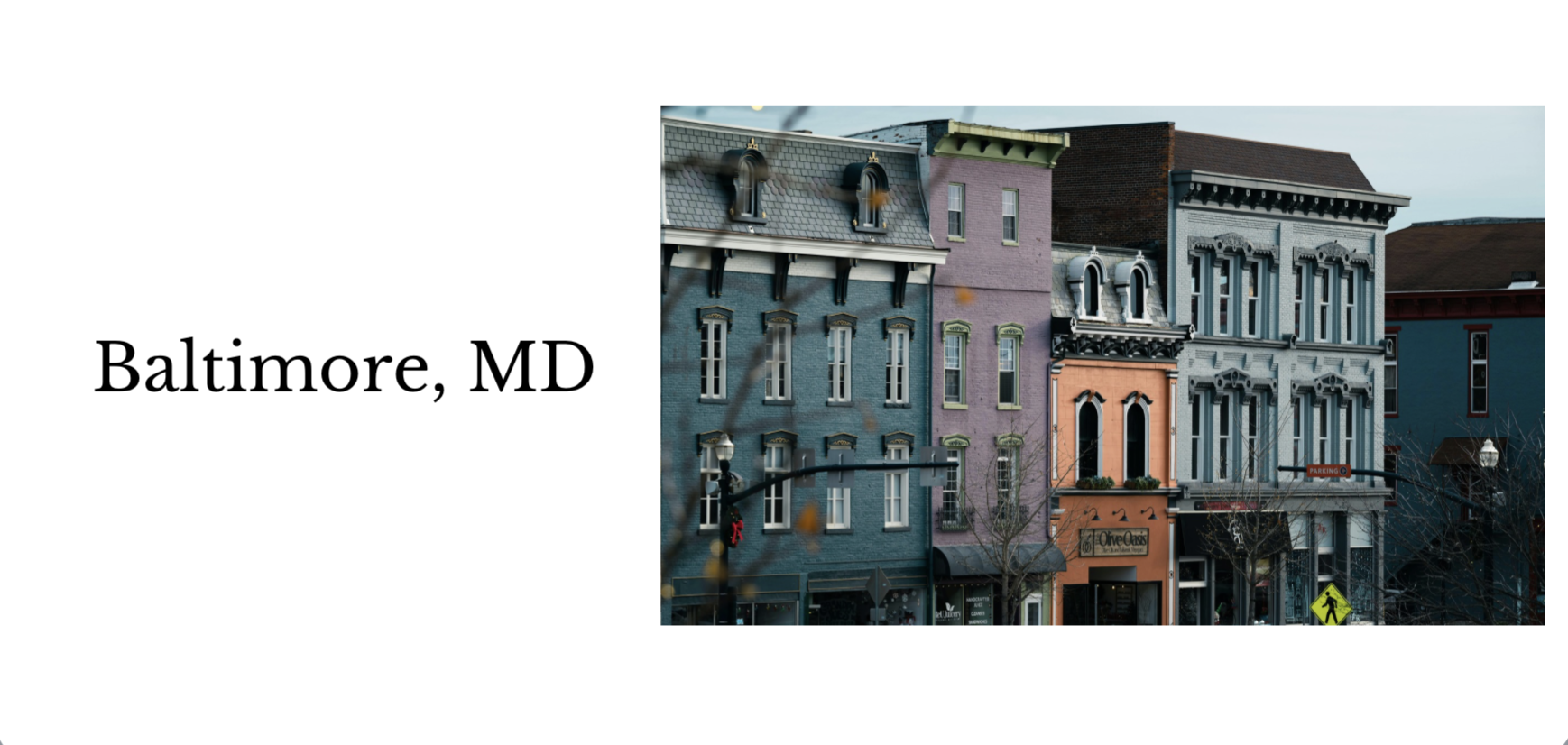 Colorful row of historic buildings on a city street in Baltimore, MD, with architectural details and storefronts, including a restaurant named Olive O in the lower level.