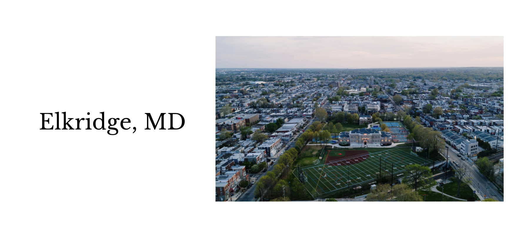 Aerial view of Elkridge, Maryland with residential neighborhoods and a sports complex including a football field and tennis courts.