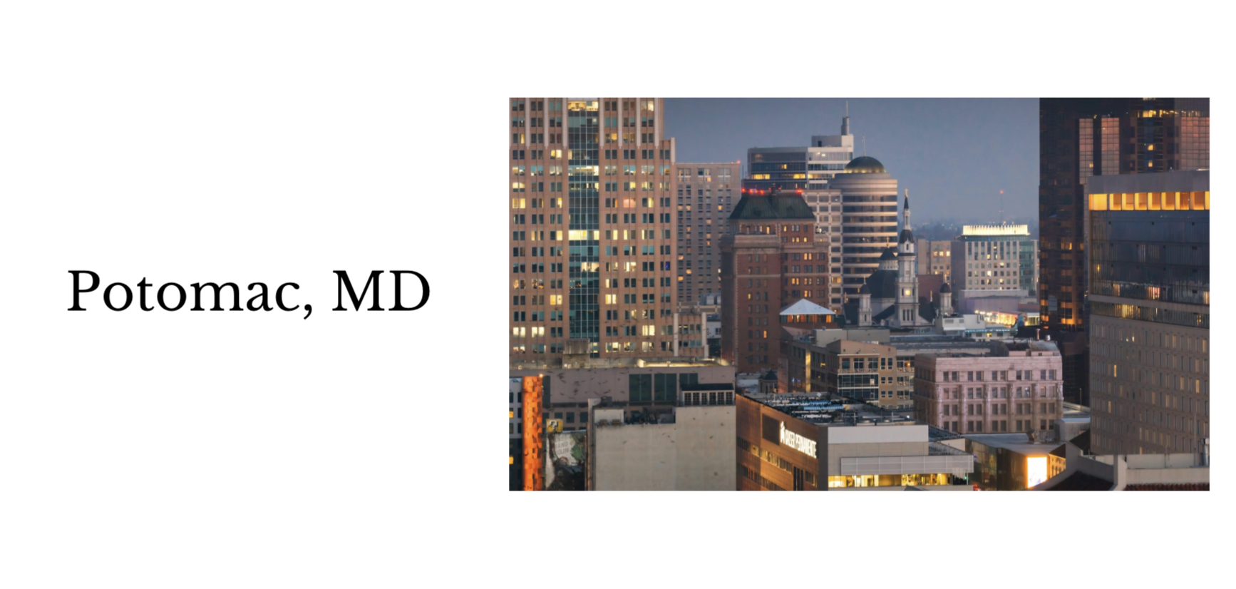 Nighttime cityscape of Potomac, Maryland with illuminated buildings and historic clock tower