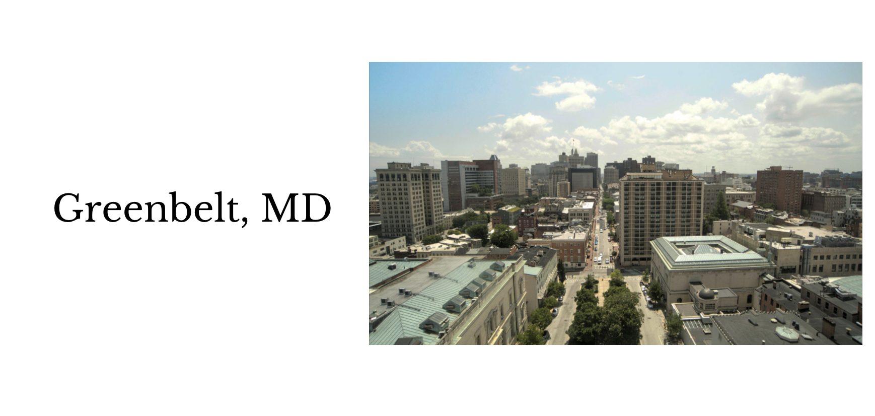 A cityscape of Greenbelt, Maryland with various tall buildings, streets, and a partly cloudy sky.