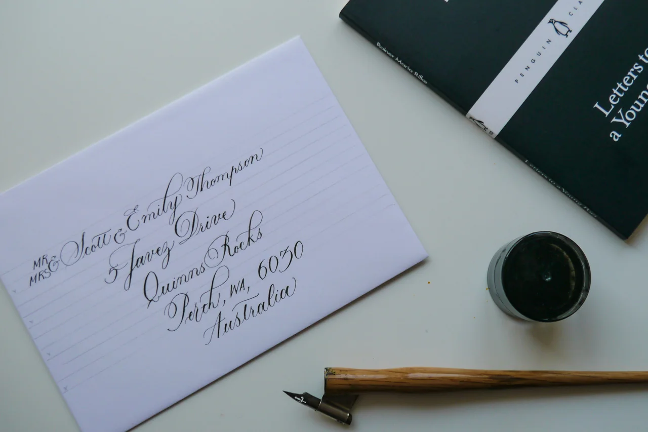 using a lettering template to address envelopes in copperplate calligraphy