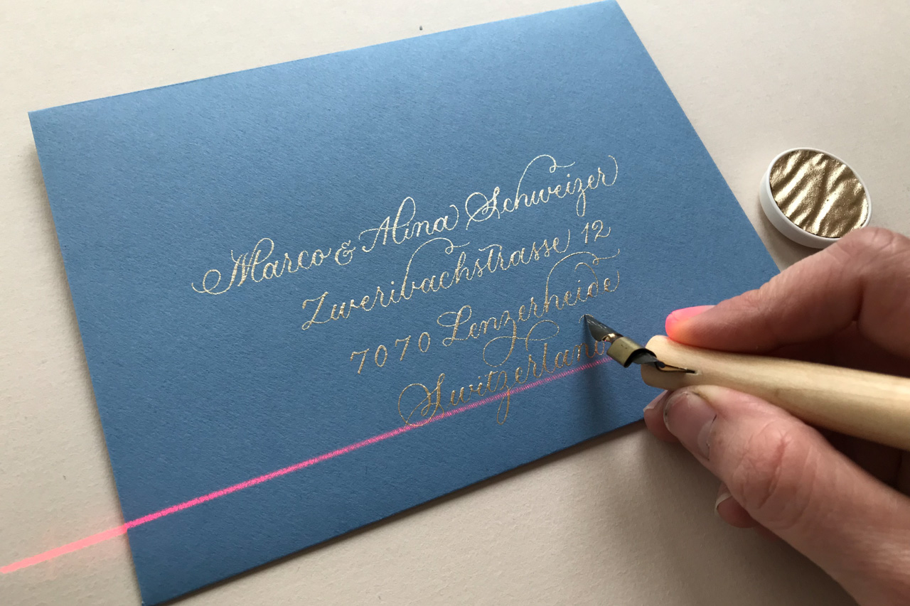 using a laser level to address envelopes in calligraphy