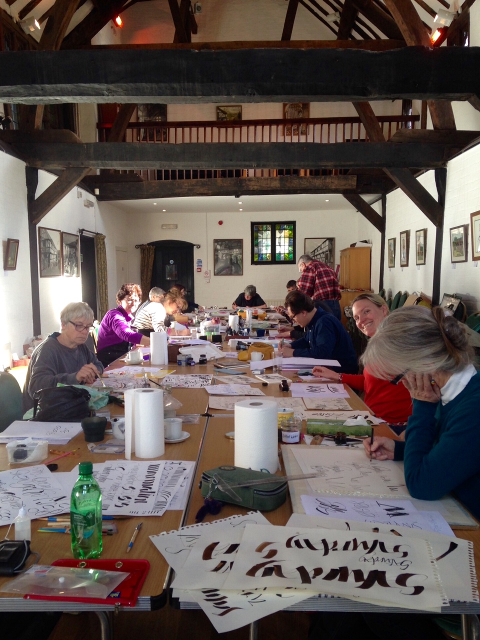 Calligraphers at work learning ruling pen