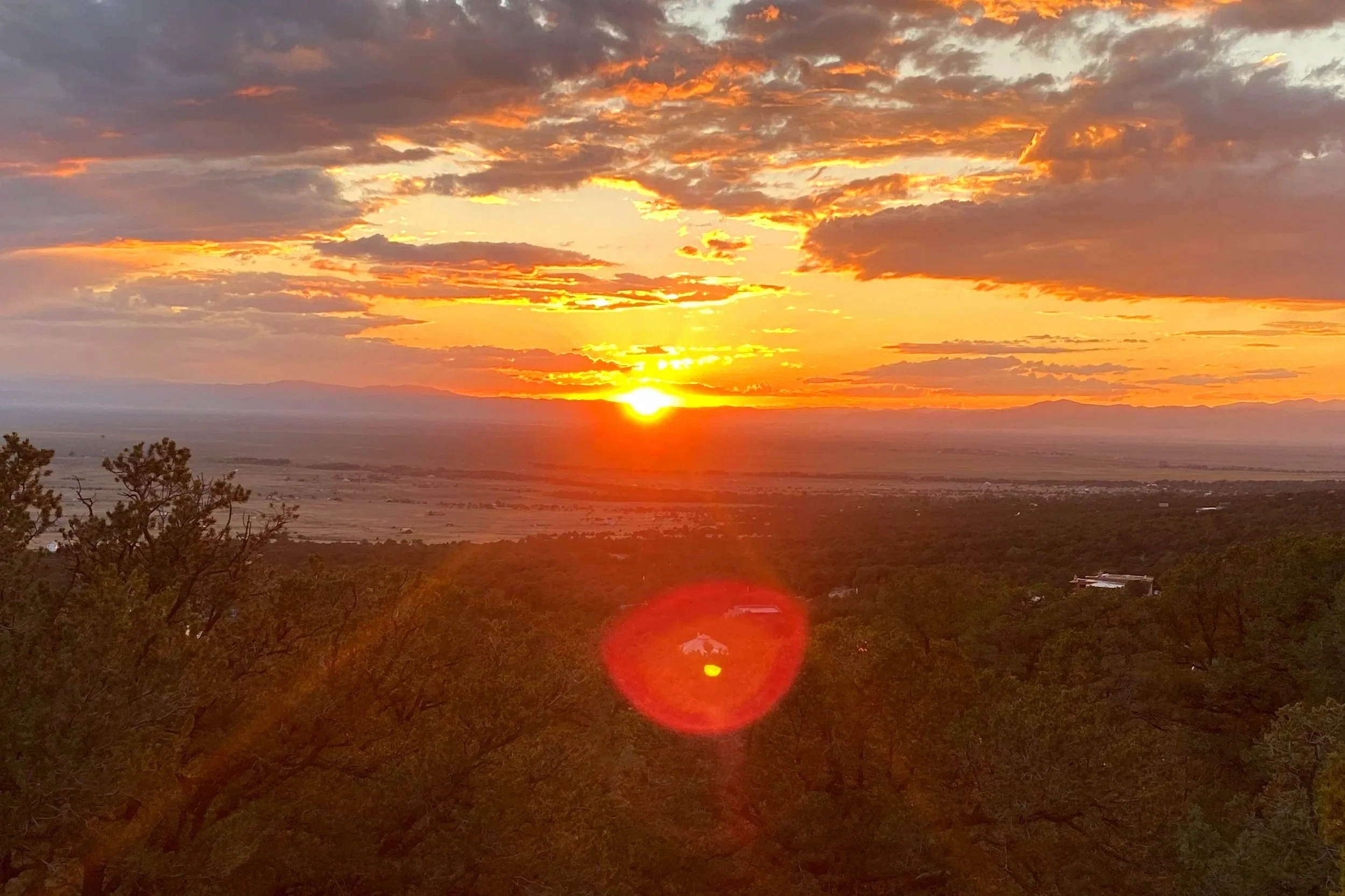 “Sunset over the Colorado mountains near Crestone, home to transformational retreats and earth-based spiritual experiences.”